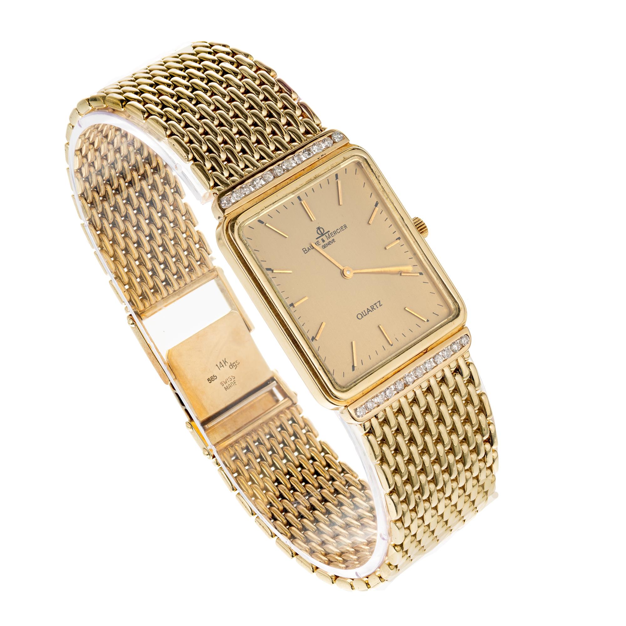 Baume & Mercier unisex 14k Yellow Gold watch with mesh band and diamond accents. Quartz movement. 

24 round full cut diamonds, Approximate .40ct
Length: 7.75 Inches long- can be shortened
Length: 33.47mm
Width: 24.60mm
Band width at case: