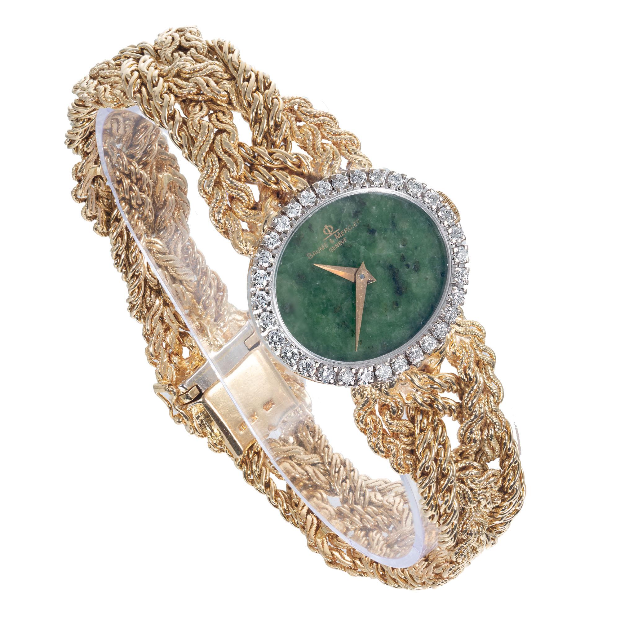 Haute Couture Baume & Mercier ladies wristwatch with a natural jade dial, diamond bezel and an 18k yellow gold case and braided band. Full original 7 ¾ Inch length. 

Approximately .75 carat diamonds F VS
Total weight 77.3 grams
Length: