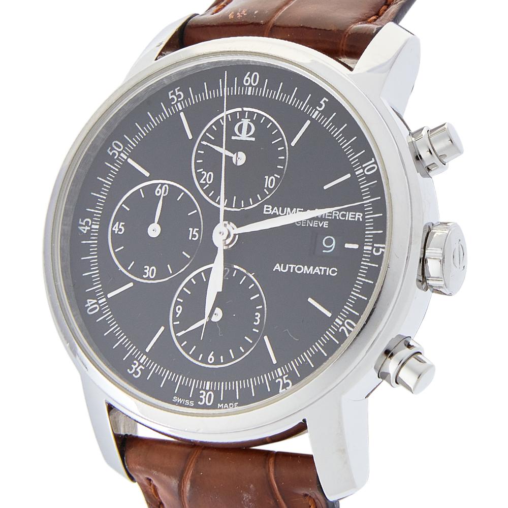 Make the right style choice with this Classima Executive timepiece from Baume & Mercier. Swiss-made, the watch has a stainless steel case held by leather straps. It has an automatic movement and carries a black dial set with distinct markers, three