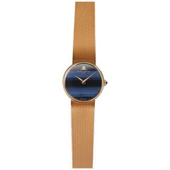 Reloj Baume & Mercier Ojo de Halcón Azul en Oro Amarillo de 18 quilates, años 1970