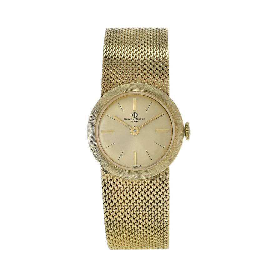 Die Baume & Mercier Armbanduhr aus den 1960er Jahren mit 14-karätigem Goldarmband ist ein Wunderwerk im Vintage-Stil, das Eleganz und Raffinesse ausstrahlt. Mit seinem schlanken 24-mm-Gehäuse und Armband aus 14-karätigem Gold, das mit einer