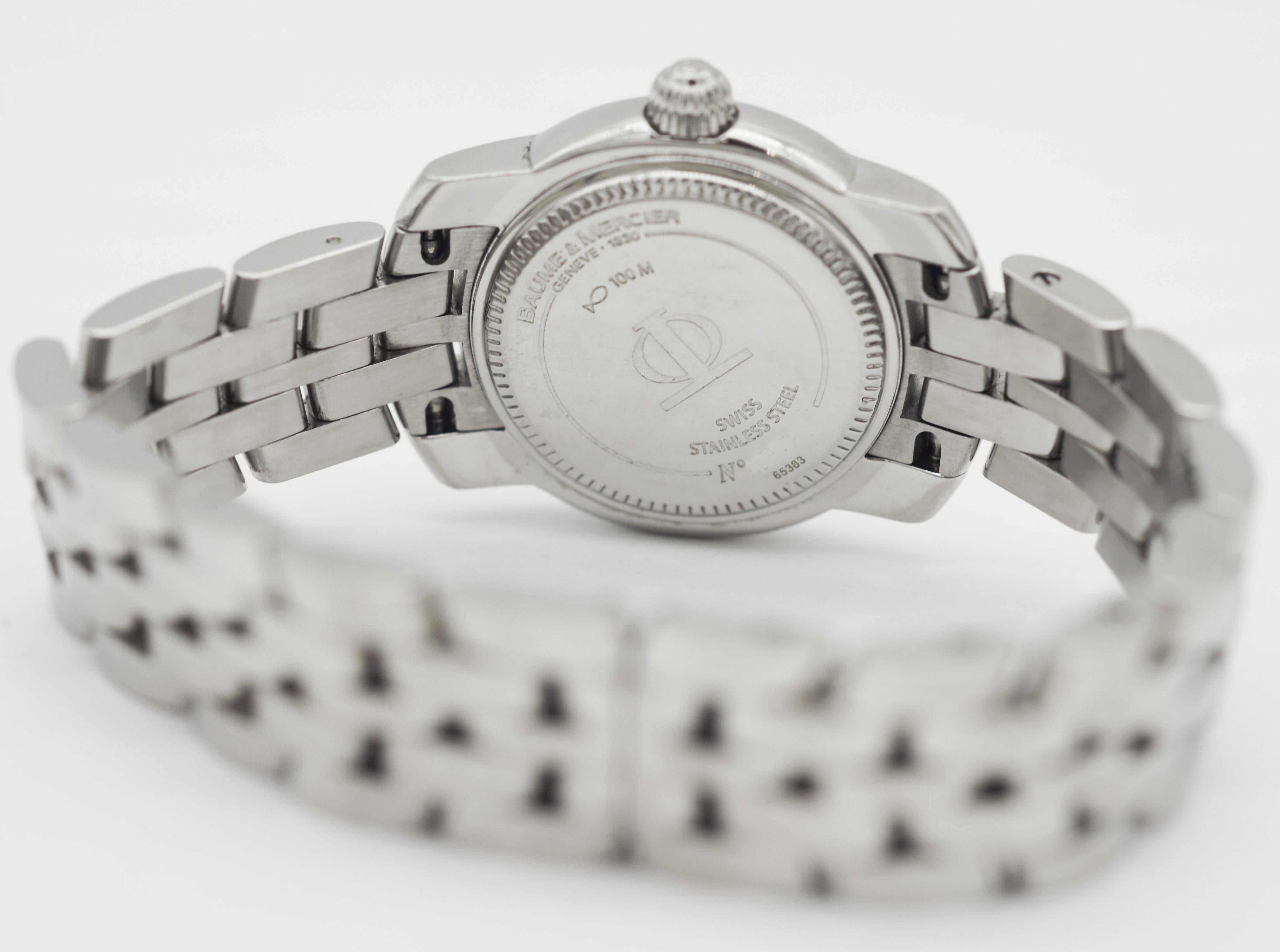 BAUME & MERCIER Capeland 65383 Montre à lunette diamantée Bon état - En vente à San Fernando, CA