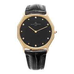 Vintage Baume & Mercier Classic 97266 in yellow gold w/ a black dial 31.5mm Quartz watch