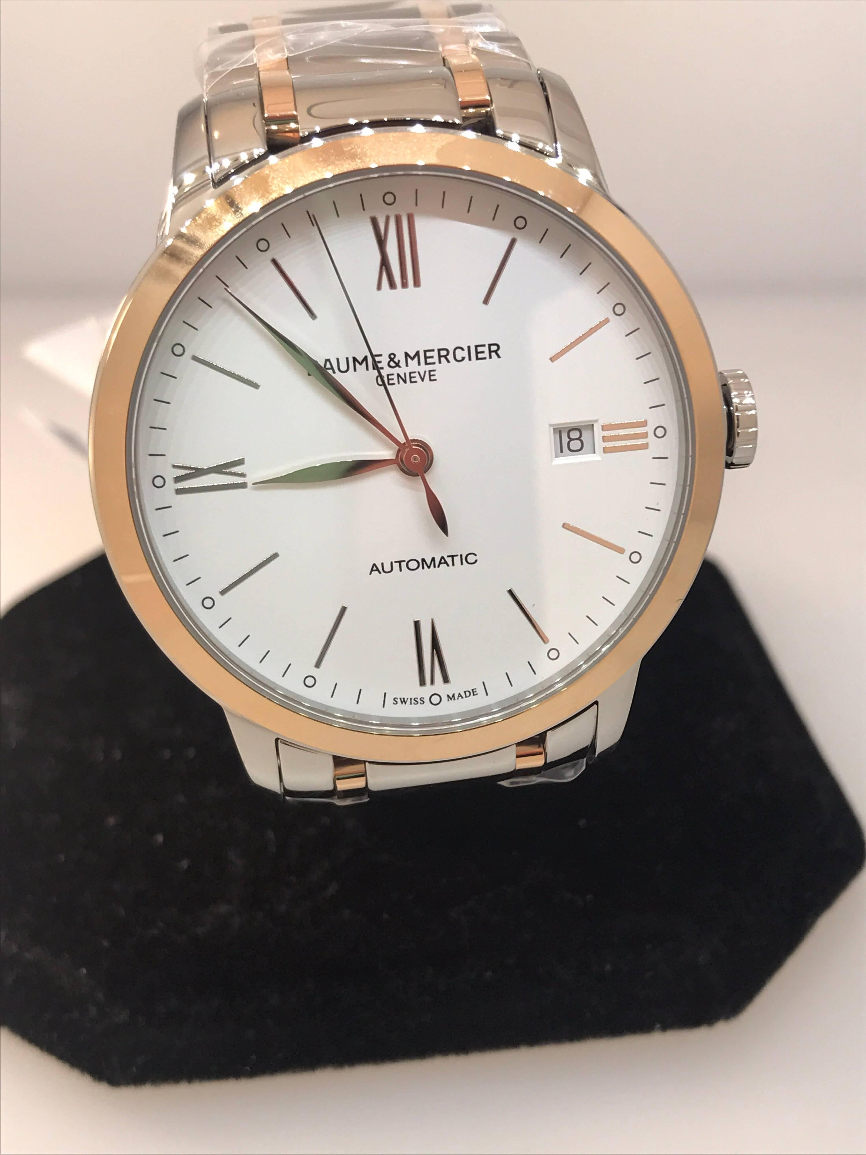 Baume & Mercier Classima Mens Watch

Model Number: M0A10314

Brand New

Comes with original Baume & Mercier box, warranty card, and insruction manual

18 Karat Rose Gold & Stainless Steel Case & Bracelet

White Dial

Rose Gold Tone Roman Numeral &