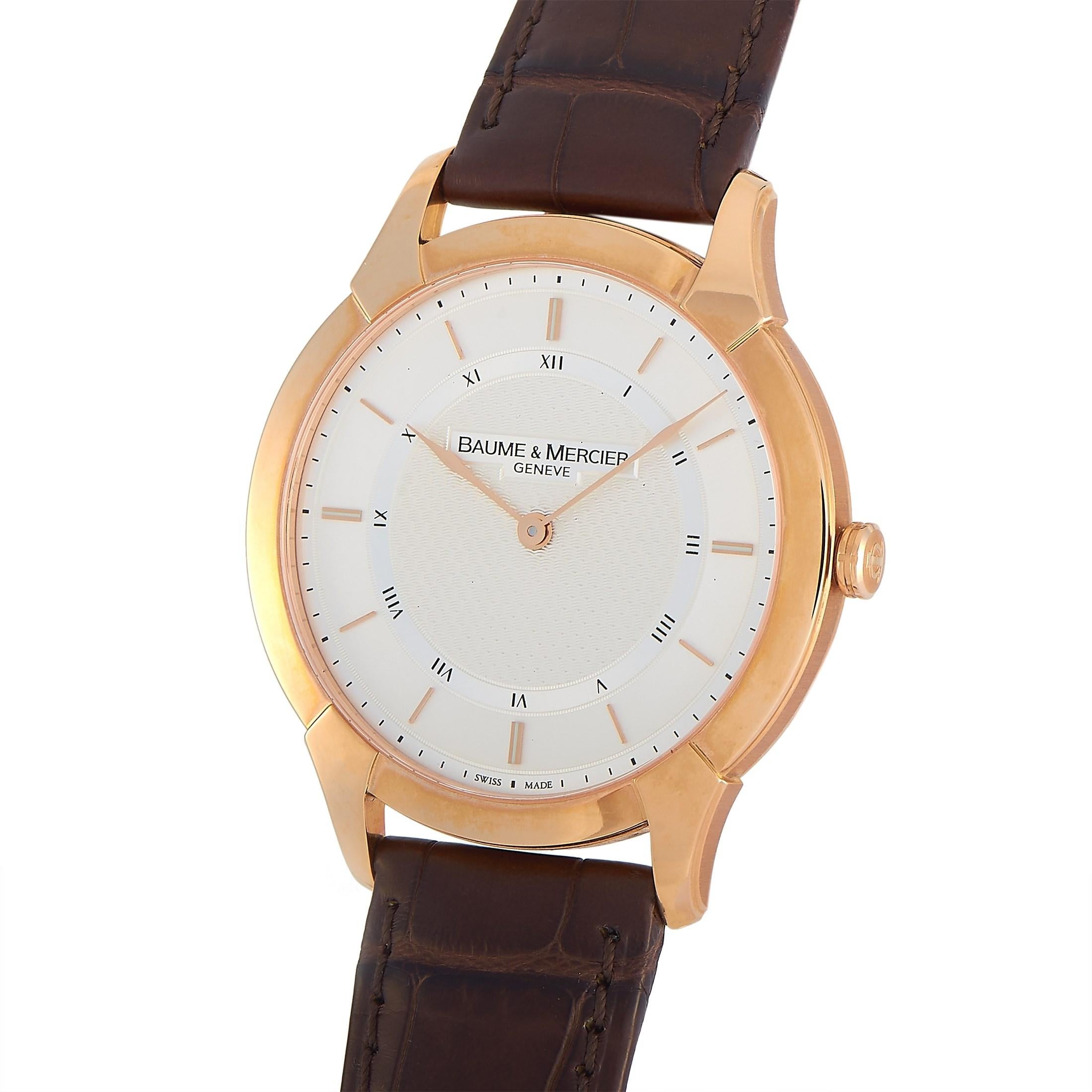 The Baume & Mercier Classima Executives Watch, reference number M0A08801, is the picture of class and sophistication.

This elegant watch features an 18K rose gold, 41mm case attached to a brown leather band. On the stylish silver dial, you’ll find