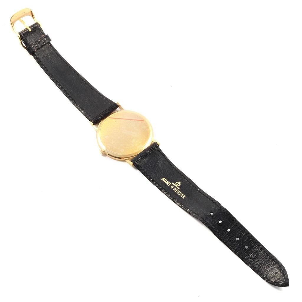 Baume Mercier Classima Ultra Thin 18K Yellow Gold Quartz Watch 15603. Quartz movement. 18K yellow gold case 32.0 mm in diameter. 18K yellow gold hobnail bezel. Mineral glass crystal. White dial with gold baton hour markers and hands. Black lizard