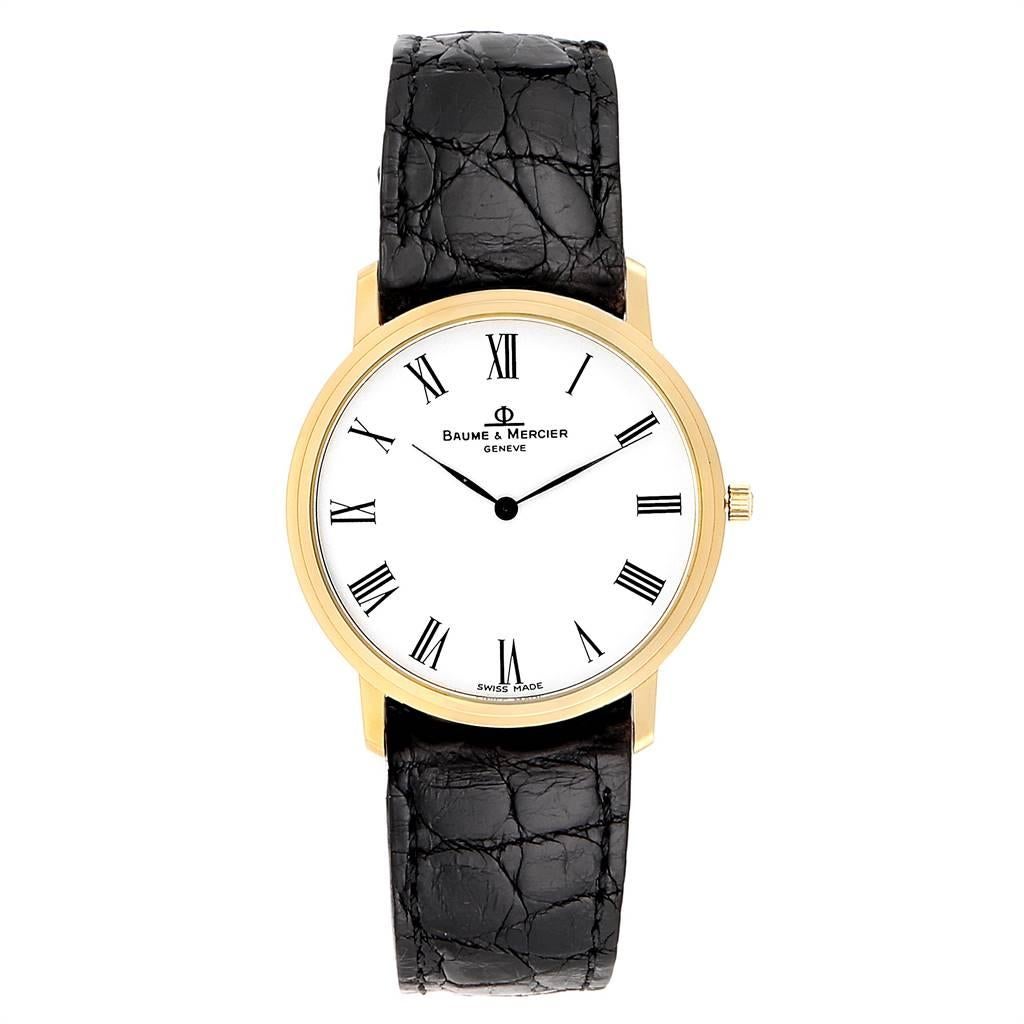 Baume Mercier Classima Ultra Thin 18K Yellow Gold Quartz Watch 95612. Quartz movement. 18K yellow gold case 33.0 mm in diameter. Mineral glass crystal. White dial with Roman numerals. Black leather strap with tang buckle. Baume Mercier box
