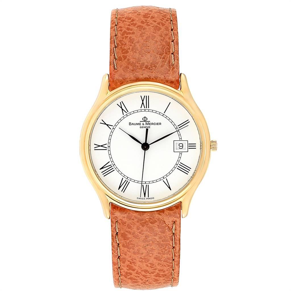 Baume Mercier Classima Ultra Thin 18K Yellow Gold Quartz Watch MV045236. Quartz movement. 18K yellow gold case 33.0 mm in diameter. Mineral glass crystal. White dial with Roman numerals. Custom orange leather strap with tang buckle. Presentation