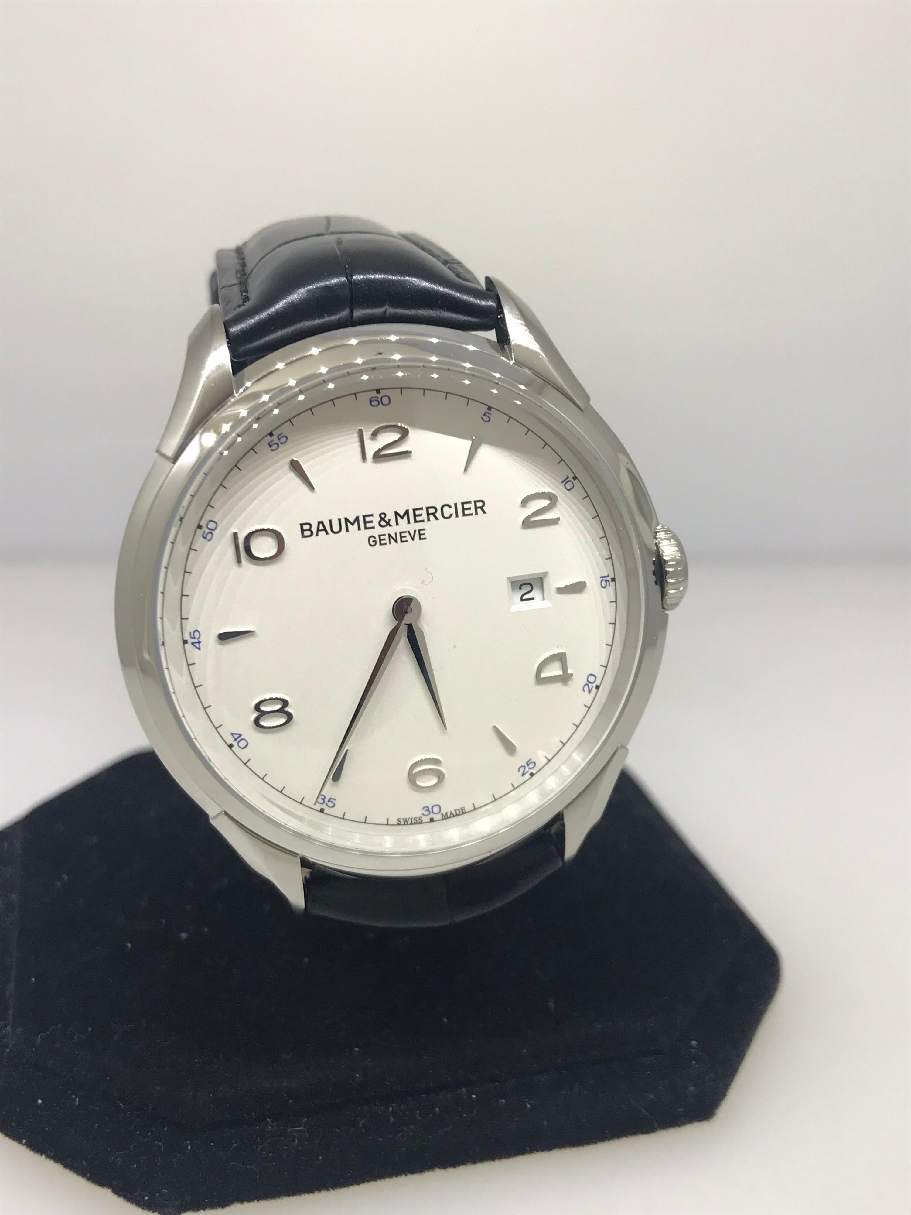 Baume & Mercier Clifton Men's Watch

Model Number: M0A10419

Brand New

Comes with original Baume & Mercier box, warranty card, and instruction manual

Stainless Steel Case & Buckle

Silver Dial

Arabic Numeral & Index Hour Markers

Quarts