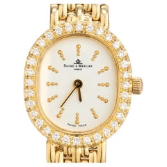 Baume
Mercier Diamond Bezel Yellow Gold Ladies Wristwatch Baume
Mercier Diamond Bezel Yellow Gold Ladies Wristwatch