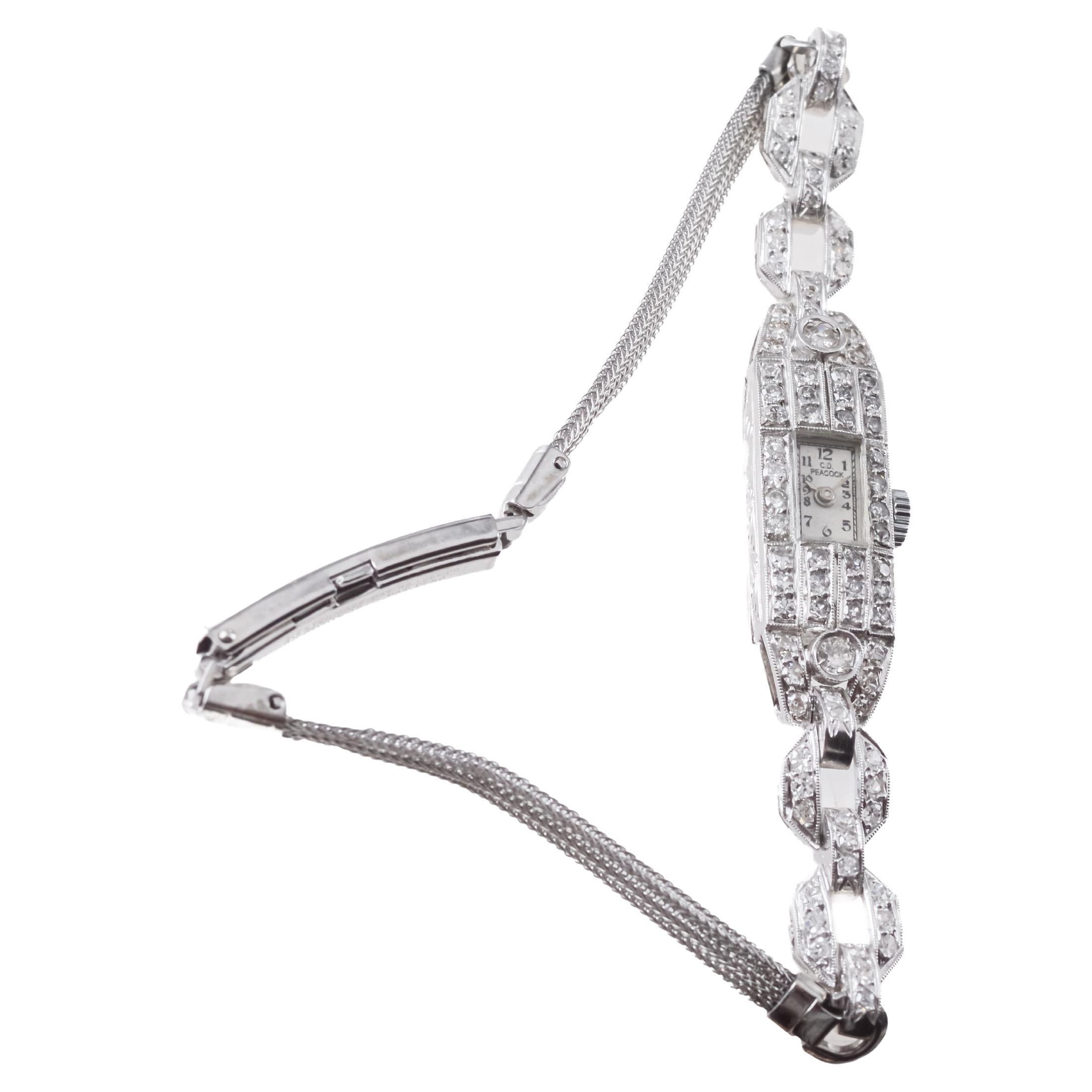 USINE / MAISON : Baume & Mercier pour C.D. Paon
STYLE / RÉFÉRENCE : Art Déco / Montre habillée
MÉTAL / MATÉRIAU : Platine et diamants
CIRCA / ANNÉE : années 1940
DIMENSIONS / TAILLE : Longueur X Largeur
MOUVEMENT / CALIBRE : Remontage manuel / 17