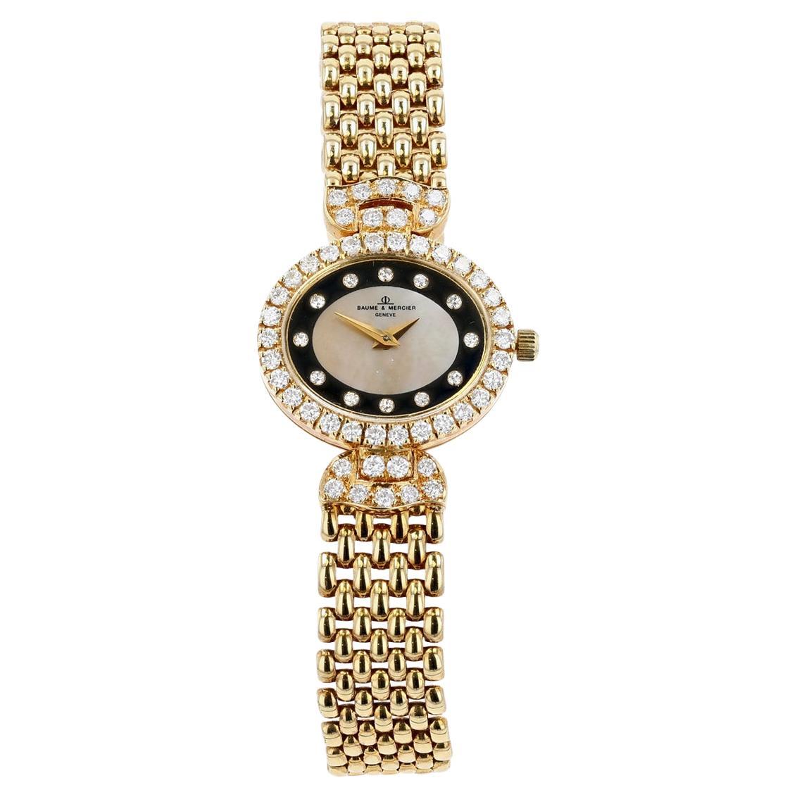 Baume & Mercier : montre en or, diamants et nacre sur bracelet en or