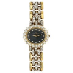 BAUME & MERCIER Orologio in oro, smalto e diamanti