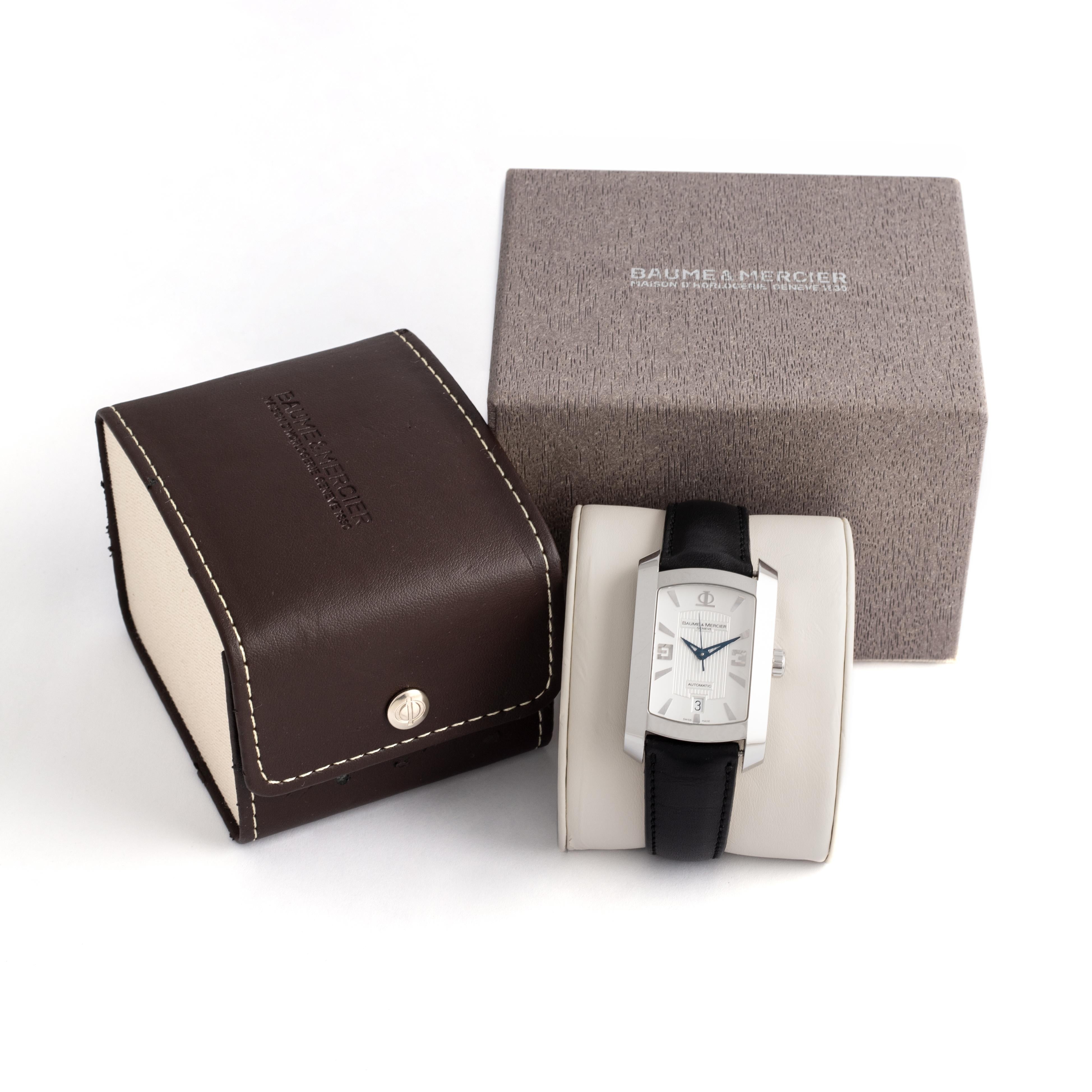 Baume & Mercier Hampton Milleis Steel Wristwatch
Leather Automatic XL, Silver ligne guilloche deco dial black cowhide leather bracelet.
Automatic movement.
Signed and numbered.
Original Baume & Mercier box.

We do not guarantee the functioning of