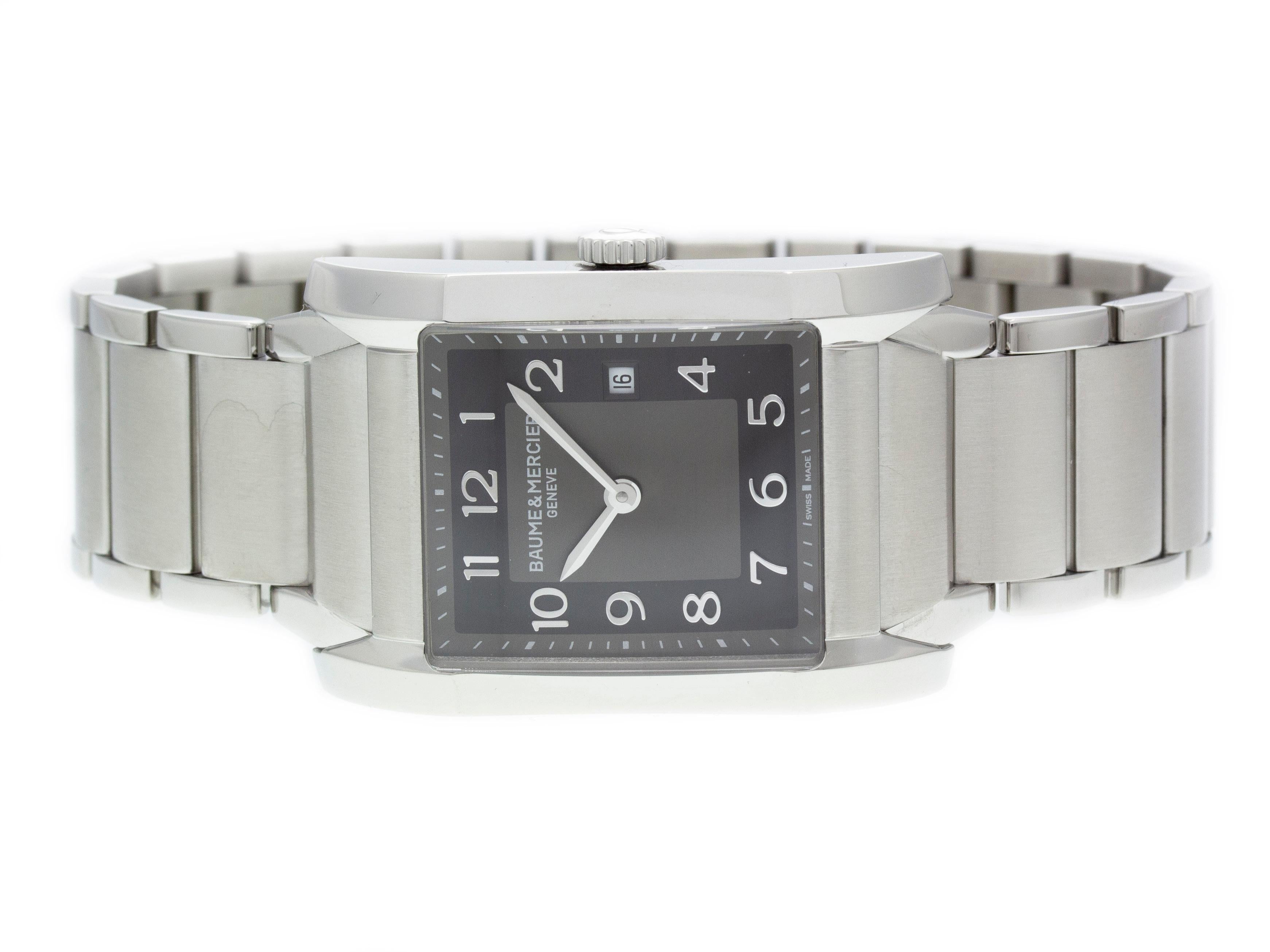 Stainless steel Baume & Mercier Hampton quartz watch with a 27mm x 40mm case, black dial, and bracelet with folding clasp. Features include hours, minutes, and date. Comes with a Deluxe Gift Box and 2 Year Store Warranty.​

Brand	Baume &