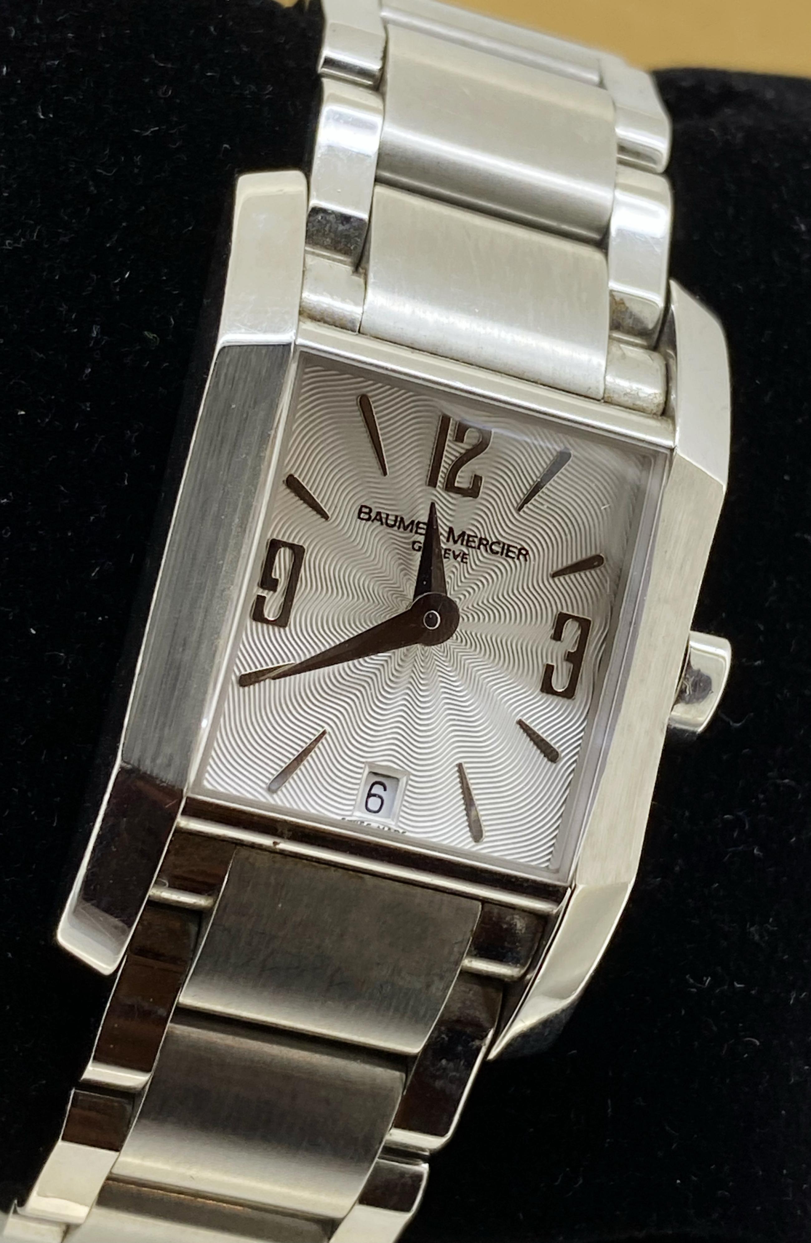 This sophisticated Baume & Mercier Hampton
ref. 65488 Ladies’ Wristwatch 
is in great condition & in excellent working order

It features:

A sought-after Stainless-Steel Rectangle Case,
measuring 22mm (not including crown) x 35mm (from lug to