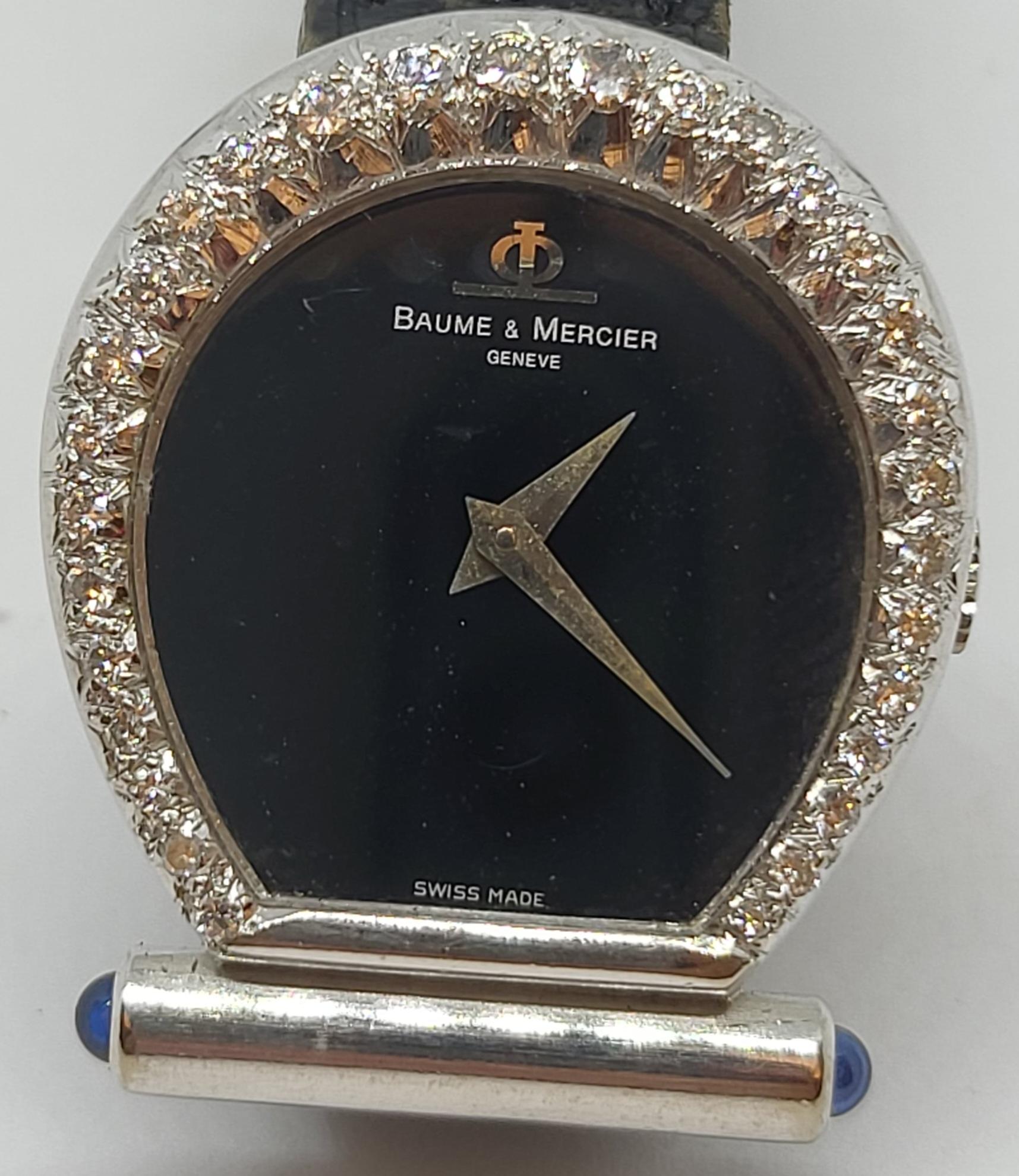Baume & Mercier Horsebit 18 k White Gold Watch & Diamonds

Extremely Rare & Collectors Watch.

Movement : Mechanical with Manual winding & 17 Jewels
Strap: Baume & Mercier Black Leather
Case : 18 kt Solid white gold Diamond Set , 6.3mm Thick
Dial :