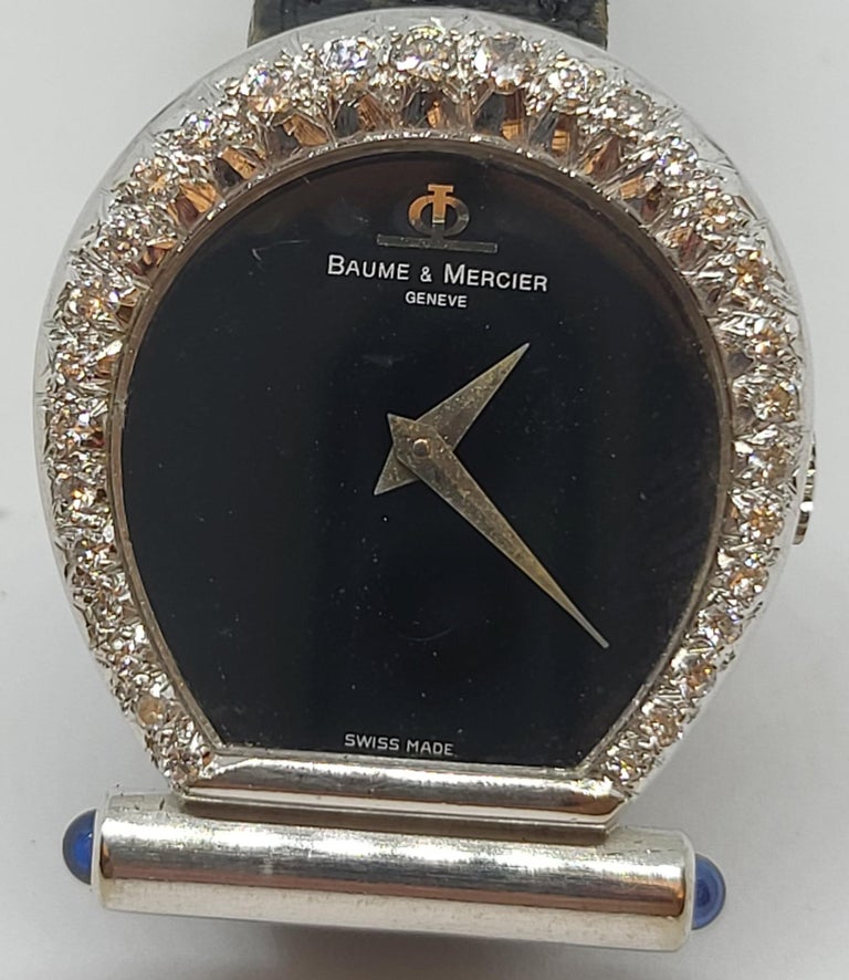 Baume & Mercier Horsebit 18 k White Gold Watch & Diamonds

Extremely Rare & Collectors Watch.

Movement : Mechanical with Manual winding & 17 Jewels
Strap: Baume & Mercier Black Croco
Case : 18 kt Solid white gold Diamond Set , 6.3mm Thick
Dial :