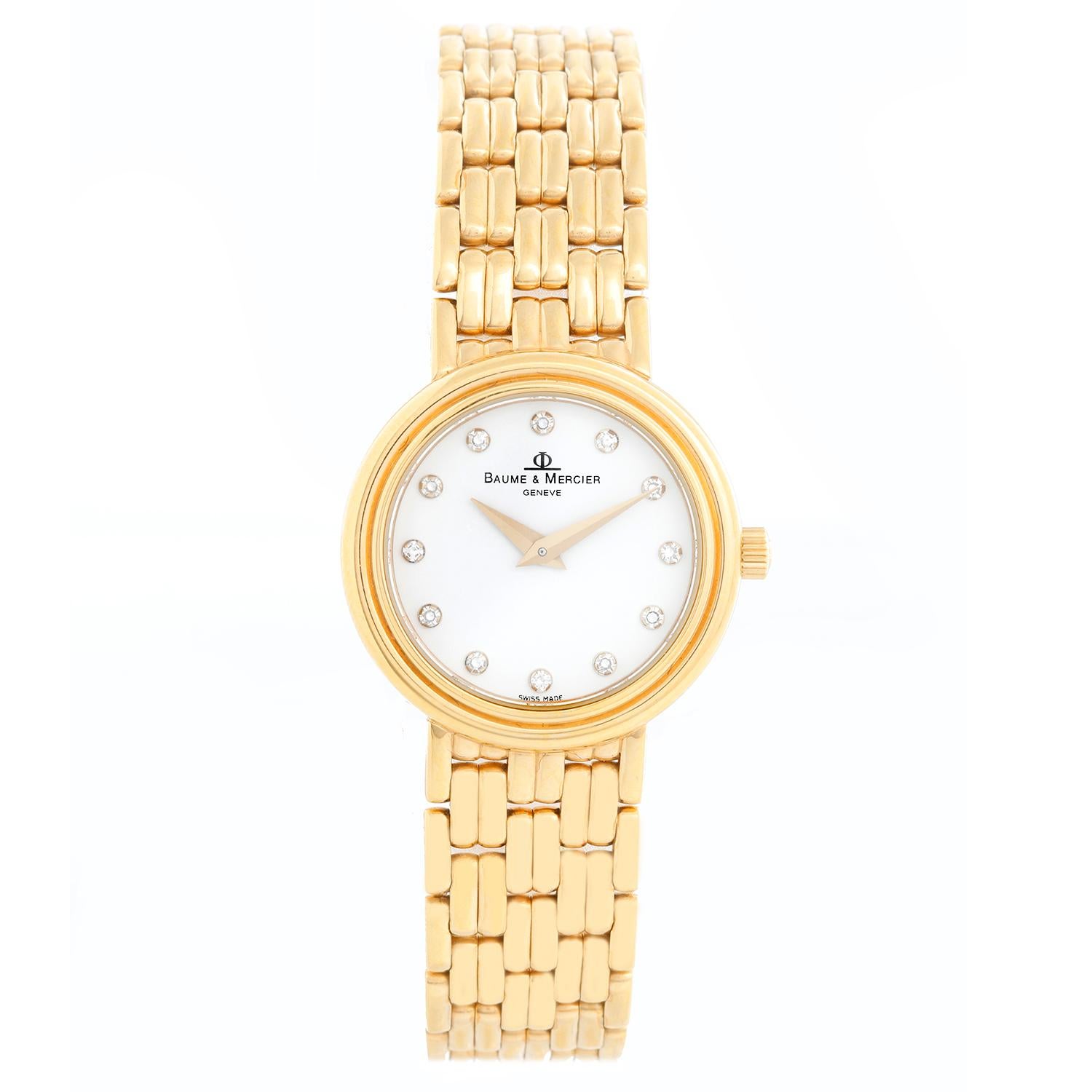 Baume & Mercier Ladies Classic Watch 65323 - Quartz. 14K  Yellow gold (23 mm). White dial with diamond dial. 14K Yellow gold bracelet; fits a 6 inch wrist bracelet . Pre-owned with  Baume box and book.