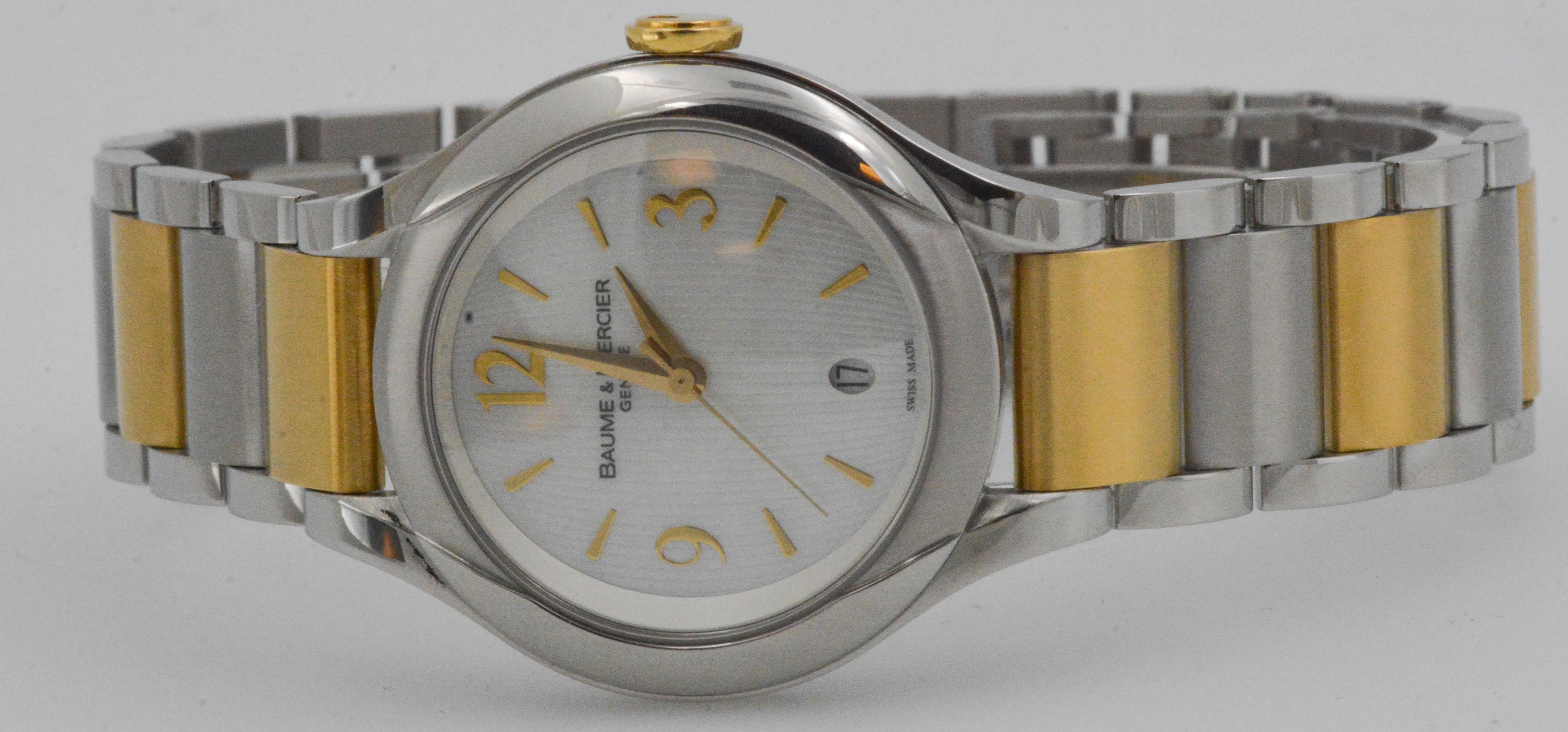 Certified Pre-Owned 18 Karat yellow gold 2-color Baume and Mercier Geneva Swiss wristwatch Linea 32 mm. Mother of Pearl face with Arabic index. 


Model 65614