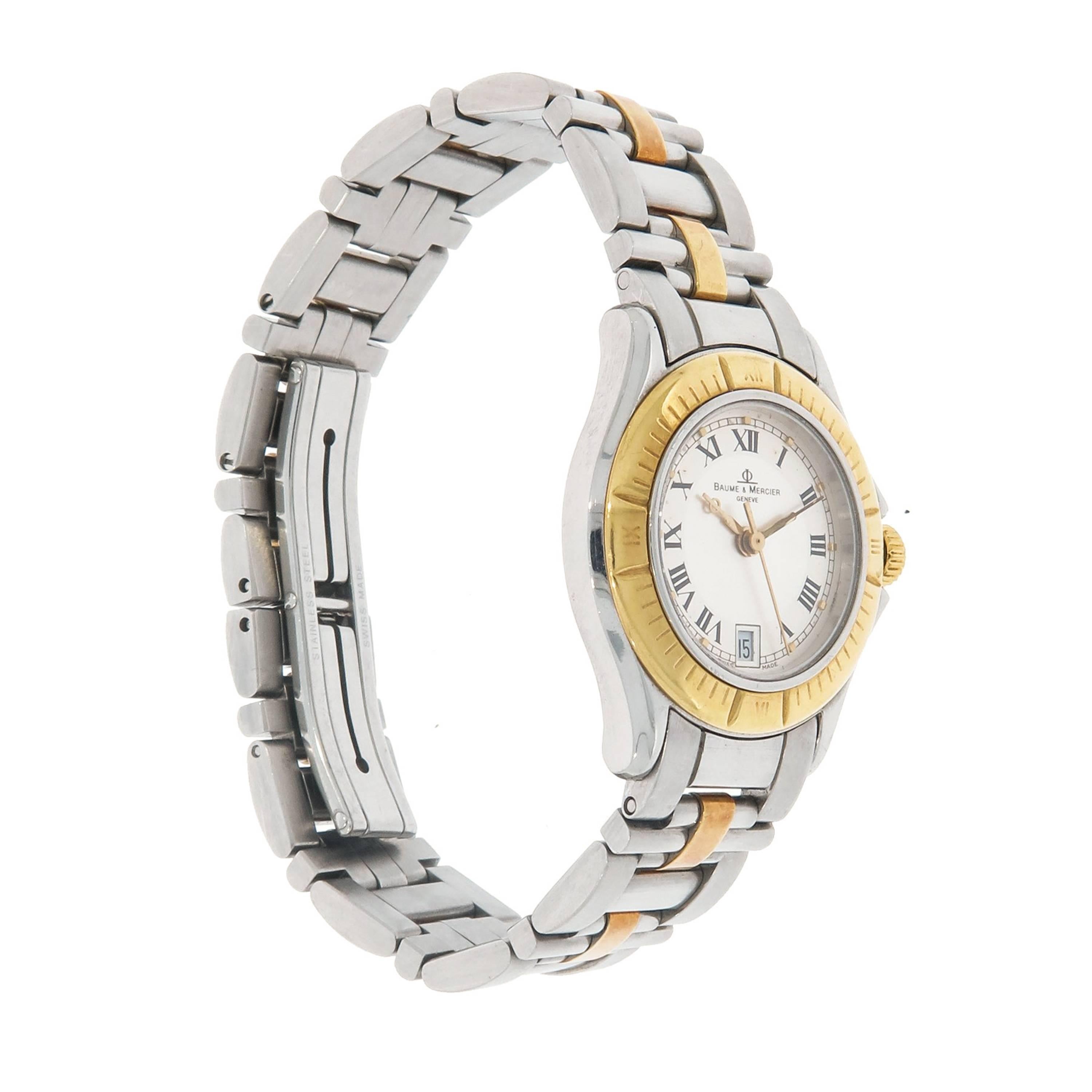 Baume & Mercier Malibu crafted in stainless steel and yellow gold.  
This timepiece features a quartz movement with indications for the Hours, Minutes, Seconds and Date.  The case measures 28mm in diameter with a total thickness of 5.8mm.  
We have