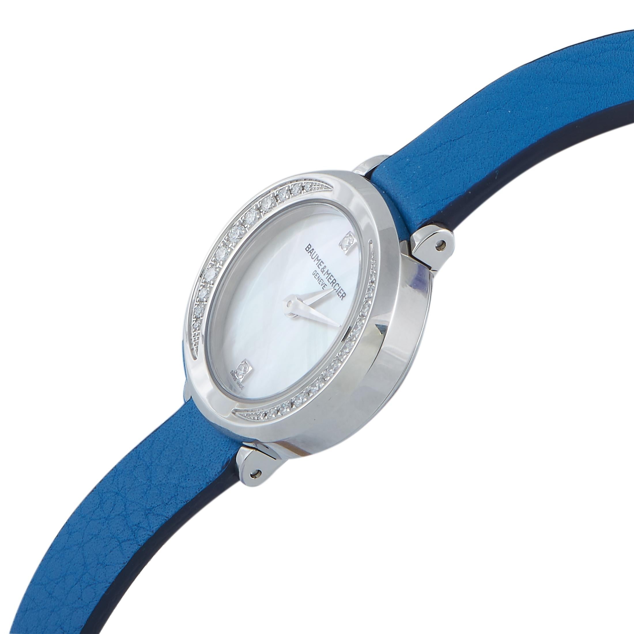 This is the Baume & Mercier Petite Promesse timepiece

The watch comes with a diamond-embellished stainless steel case that measures 22 mm in diameter. The case is mounted onto a wrap-around blue calfskin strap, secured on the wrist with a tang