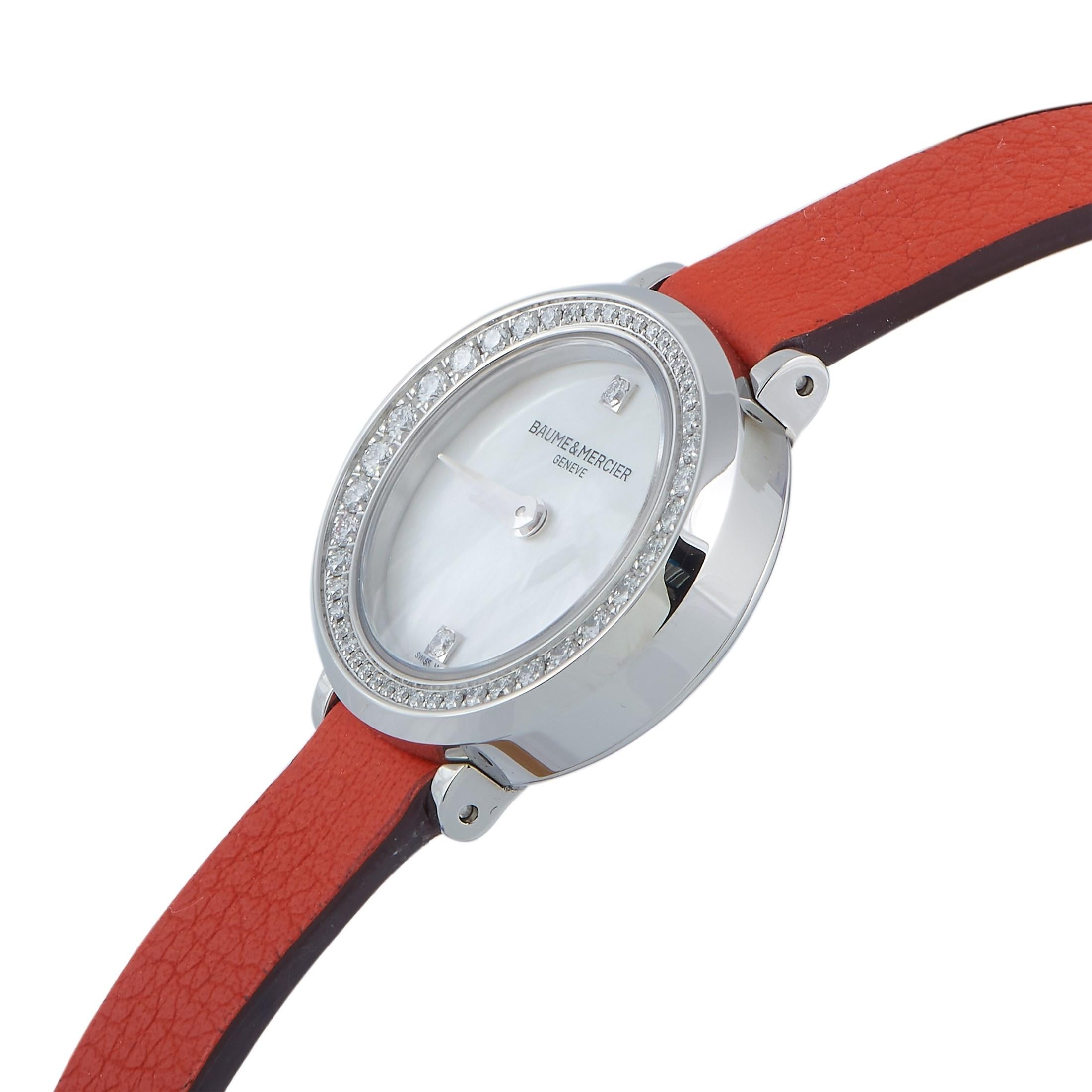 This is the Baume & Mercier Petite Promesse timepiece, reference number M0A10290.

The watch comes with a diamond-embellished stainless steel case that measures 22 mm in diameter. The case is mounted onto a wrap-around orange calfskin strap, secured