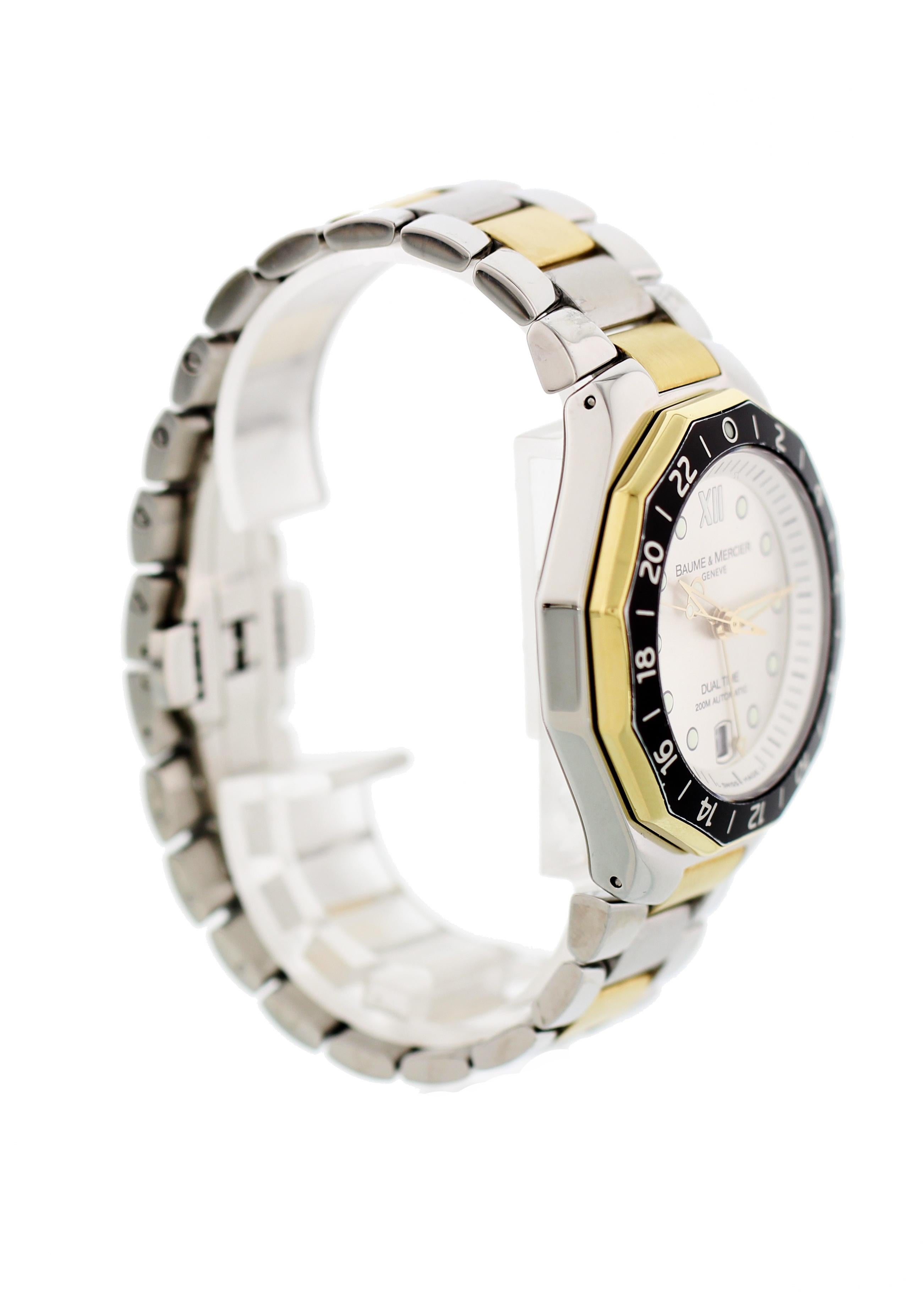 Men's Baume & Mercier Riviera Dual Time. Stainless steel 40mm case. 18k yellow gold bezel with black 24 hour insert. Two tone stainless steel and yellow gold caped bracelet will fit a 6.75 inch wrist. Silver dial with luminous hands and hour