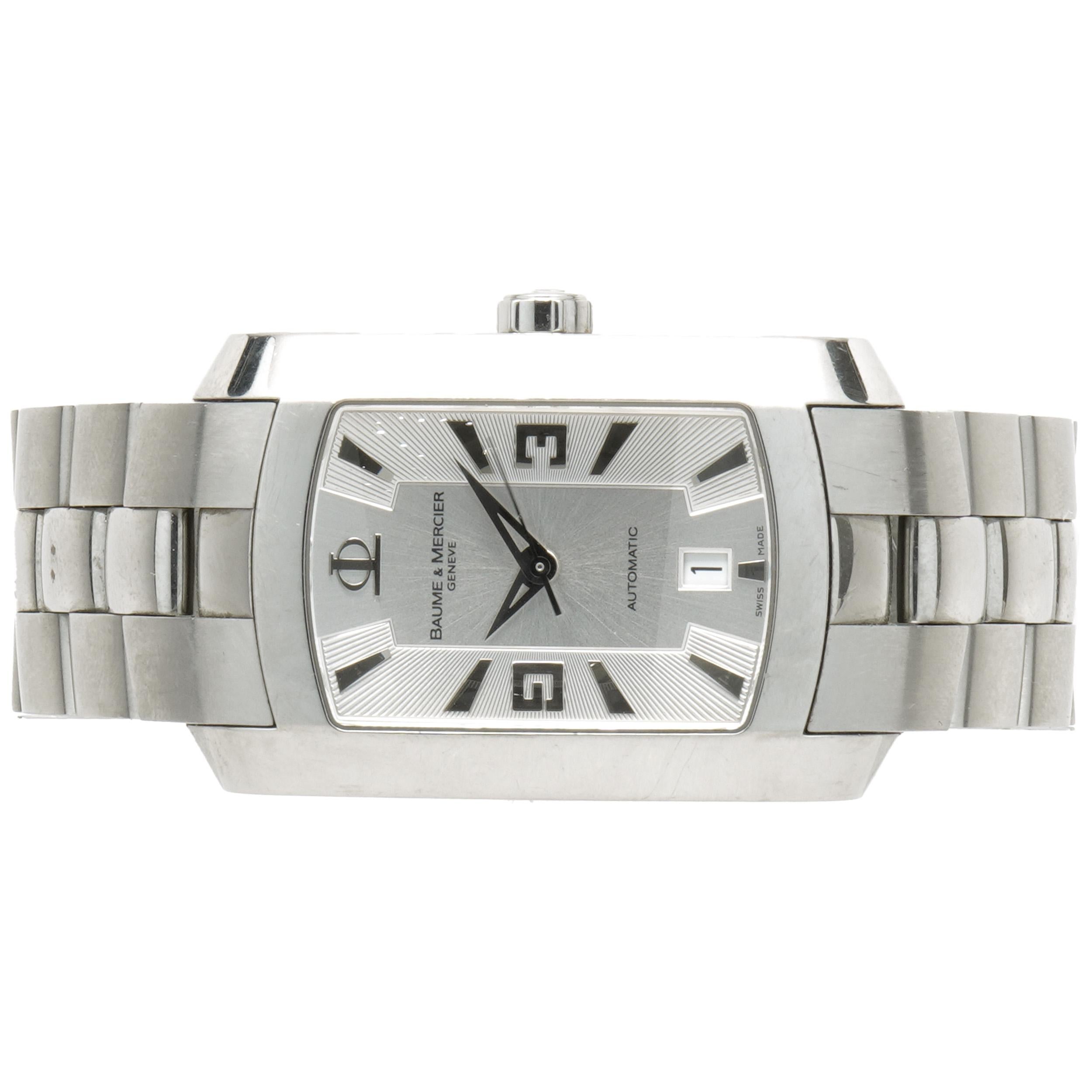 Movement: automatic
Function: hours, minutes, seconds, date
Case: 30mm rectangular stainless steel case, smooth bezel, push/pull crown, sapphire crystal
Band: stainless steel, integrated clasp
Dial: silver stick/arabic
Serial # 4693XXX
Reference #