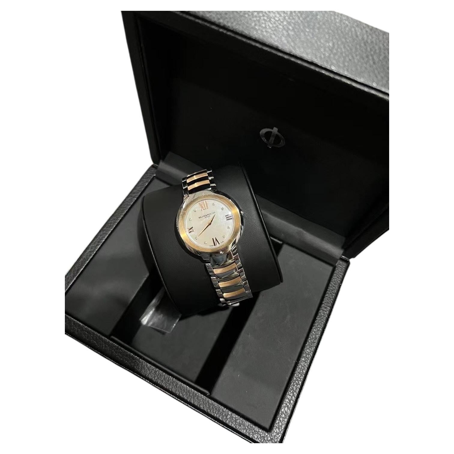 Baume & Mercier Reloj de pulsera de cuarzo con diamantes y madreperla bicolor para señora