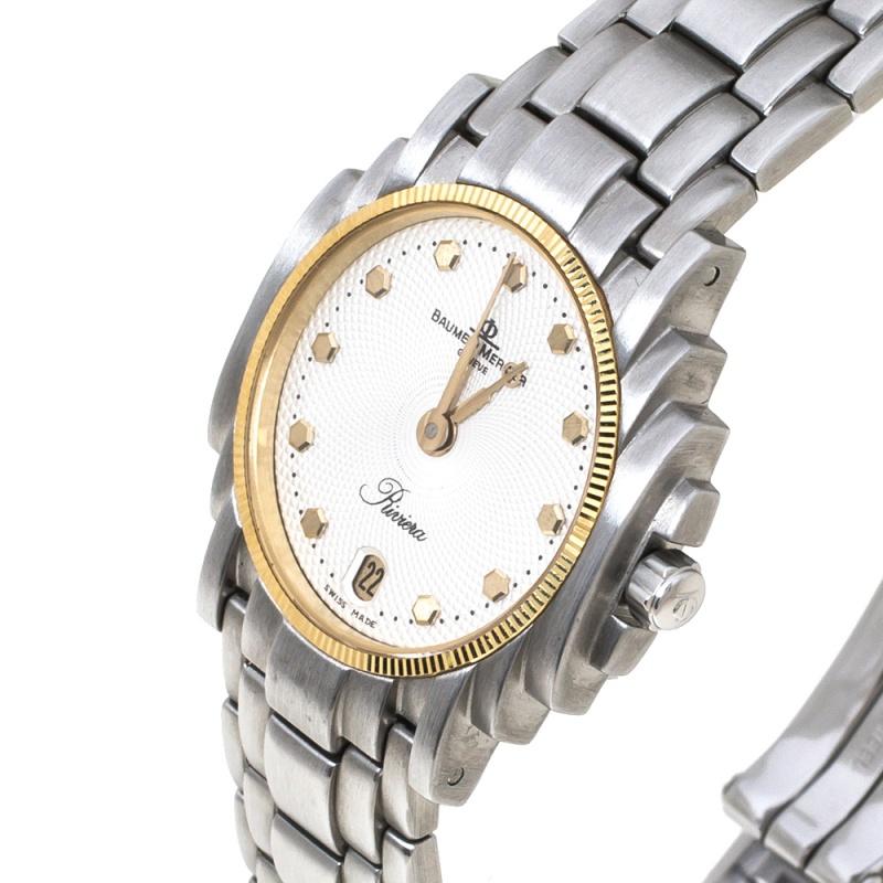 The Baume & Mercier White Stainless Steel Riviera wristwatch exudes style. Made of durable stainless steel, the watch has an elegant dial with gold-tone hour markers and hands The link bracelet is secured by a simple clasp.


