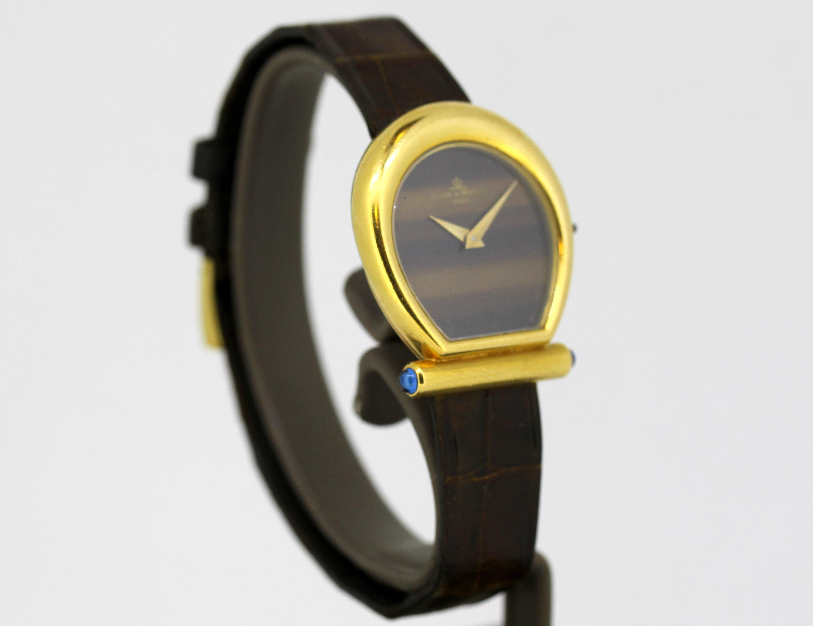 Baume & Mercier - 18k Gold & Tigerauge - 464325 - Damen - 1990-1999

Geschlecht: Damen
Gehäusebreite: 25 mm
Uhrwerk: Handaufzug
Material des Uhrenarmbands: Leder 
Material Gehäuse: 18k Gold
Anzeige Typ:	Analog	
Zifferblatt: Tigerauge (siehe