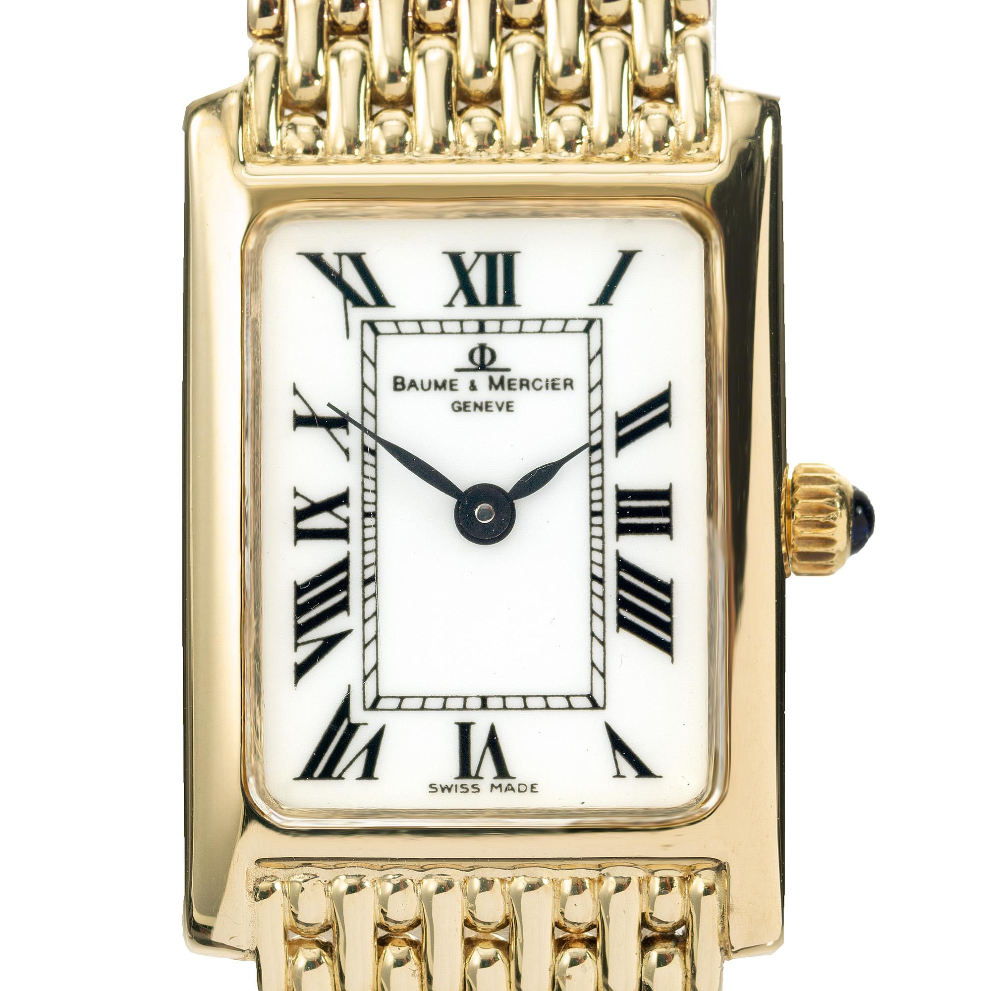 Montre-bracelet classique Baume & Mercier en or jaune 14k pour femmes. Boîtier rectangulaire avec cadran blanc et chiffres romains. La montre est dotée d'un bracelet en maille de style panthère et mesure 6,62 pouces. Le mouvement à quartz de la