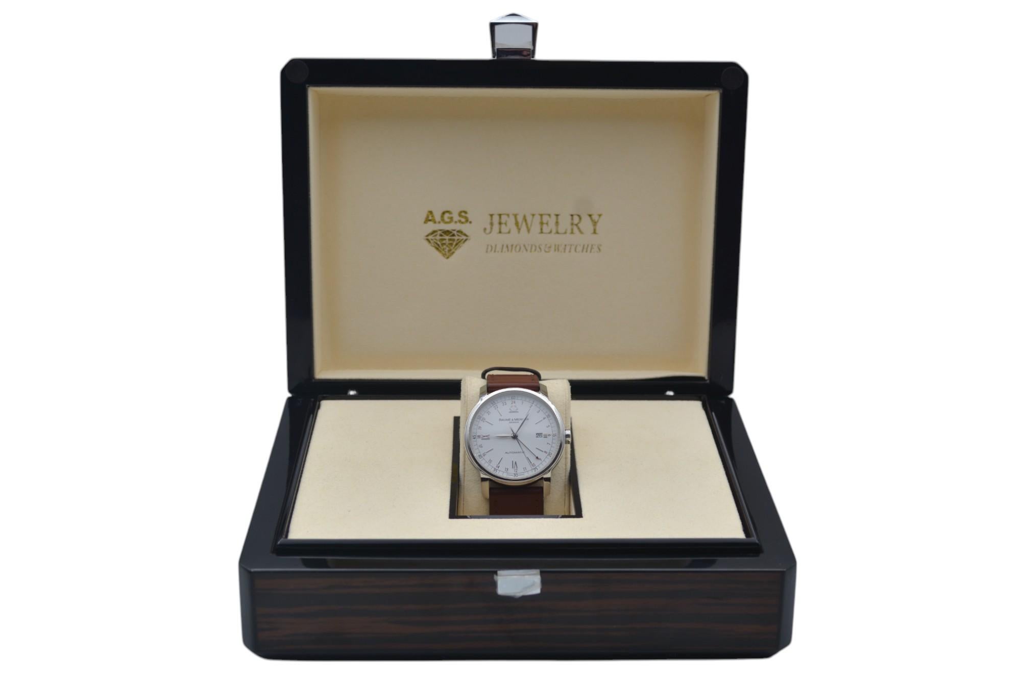 La montre est en très bon état, elle est polie professionnellement et fonctionne bien. Il présente de légers signes d'usure. La montre est livrée dans une boîte en bois d'AGS Jewelry, avec une carte de garantie d'AGS Jewelry. Pour plus