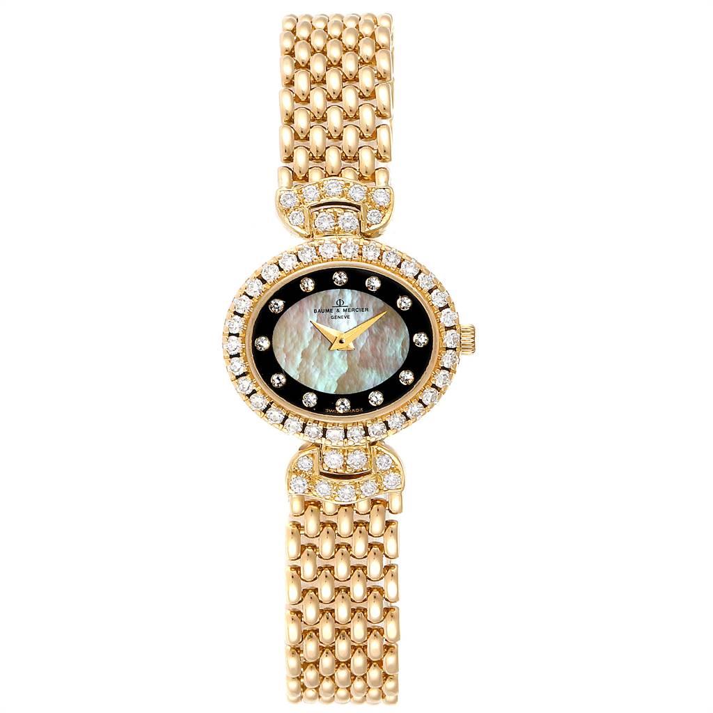 Baumer Mercier Yellow Gold MOP Diamond Vintage Cocktail Ladies Watch 18523. Quartz movement. 18k yellow gold oval case 22.0 x 19.5mm. Factory diamond lugs. 18k yellow gold factory diamond bezel. Mineral glass crystal. Mother of pearl dial with