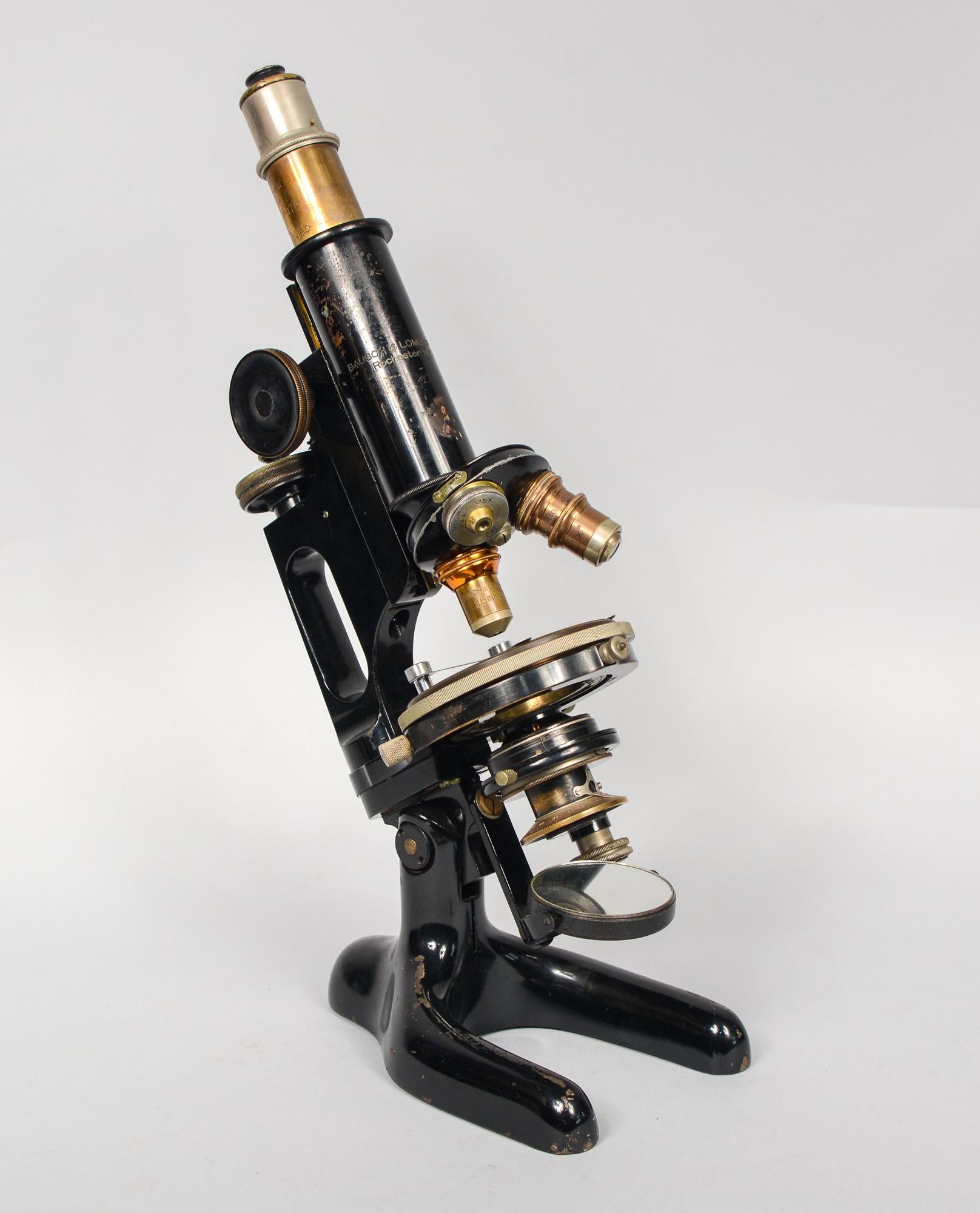 Bausch and Lomb polarizing petrographic microscope. This microscope has three objectives and a rotating stage. The dimensions listed are for the box. The microscope is 4.25 inches deep, 7 inches wide and 13 inches tall. This is from an older