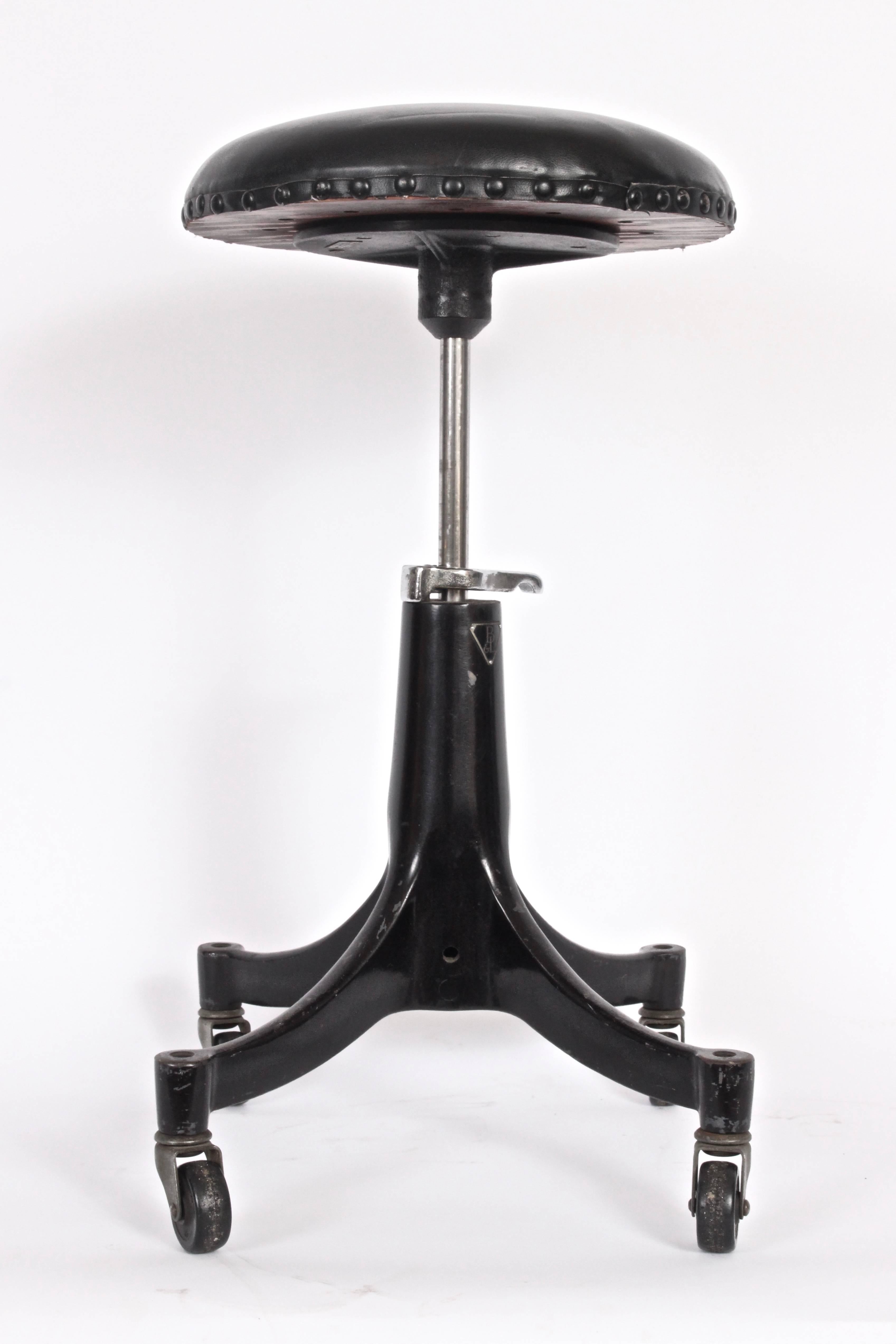 American Bausch & Lomb Machine Age Adjusting Cushioned Black Iron Rolling Stool, C. 1930s