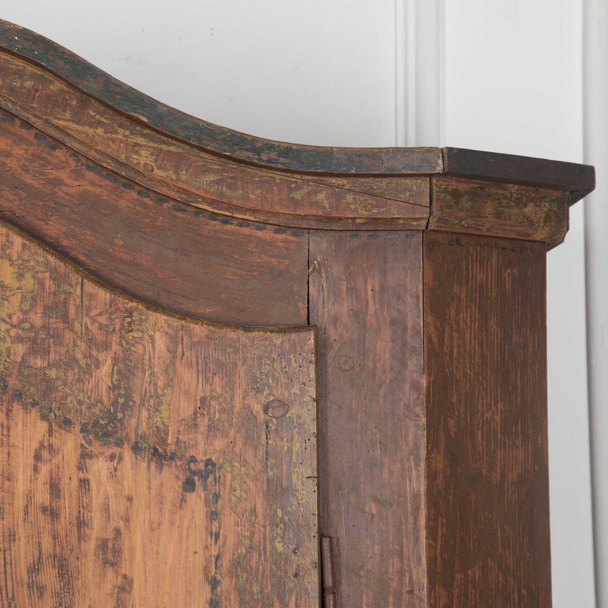 A late 18th Century Bavarian two-door armoire in remnants of original painted decoration. Feet replaced.