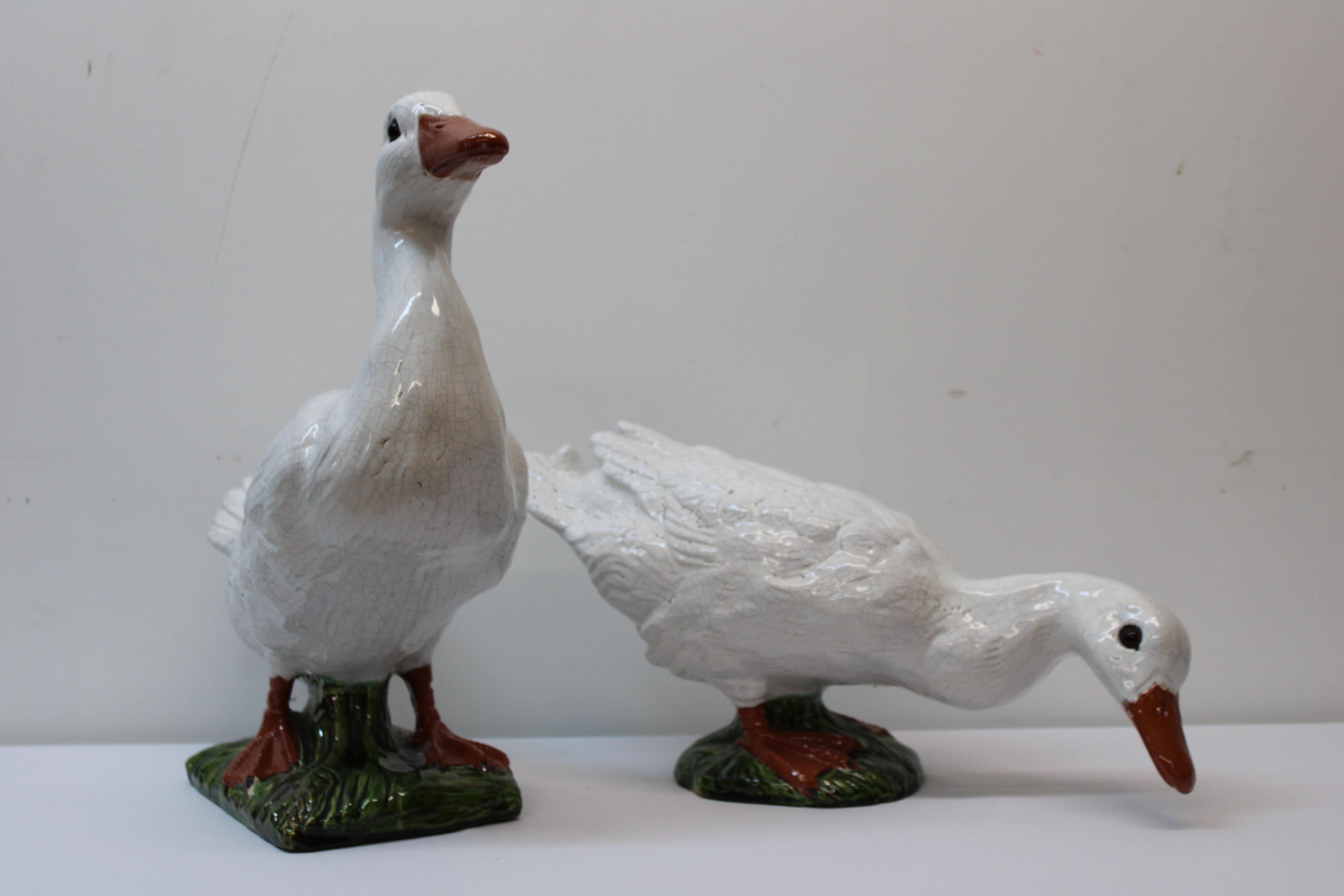 C. early 20th century

Adorable pair of Bavent Faience terracotta geese w/ glass eyes 

Made in France

Measurements of Geese 

Standing goose: 16
