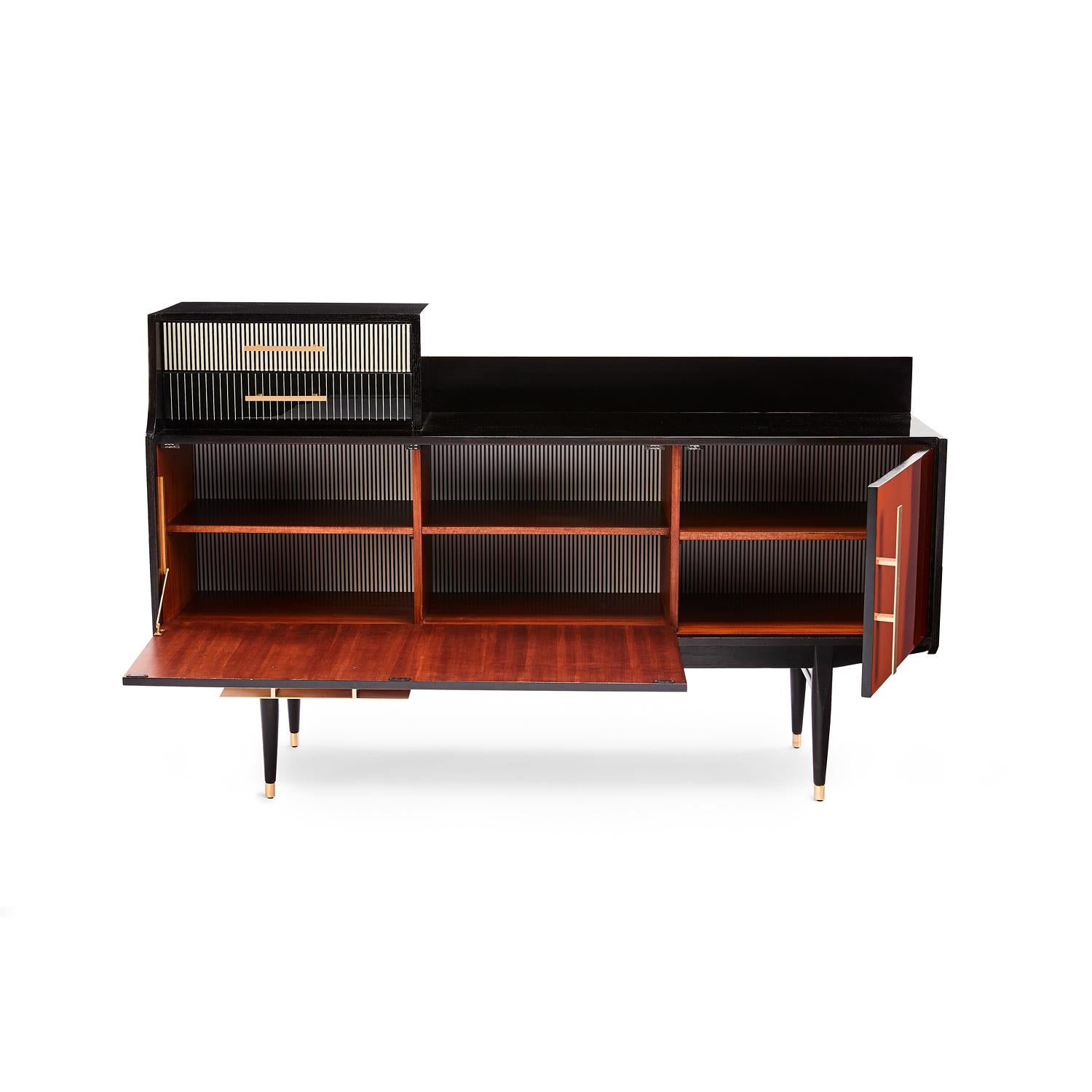 Baxter Bea cabinet dark stained and natural-oil finished rosewood accentuating dark amber gradation with satin brass hardware by Draga & Aurel

Designed By Draga & Aurel salone, 2018
Measures: 155 x 41 x 97 H cm, made in Italy.