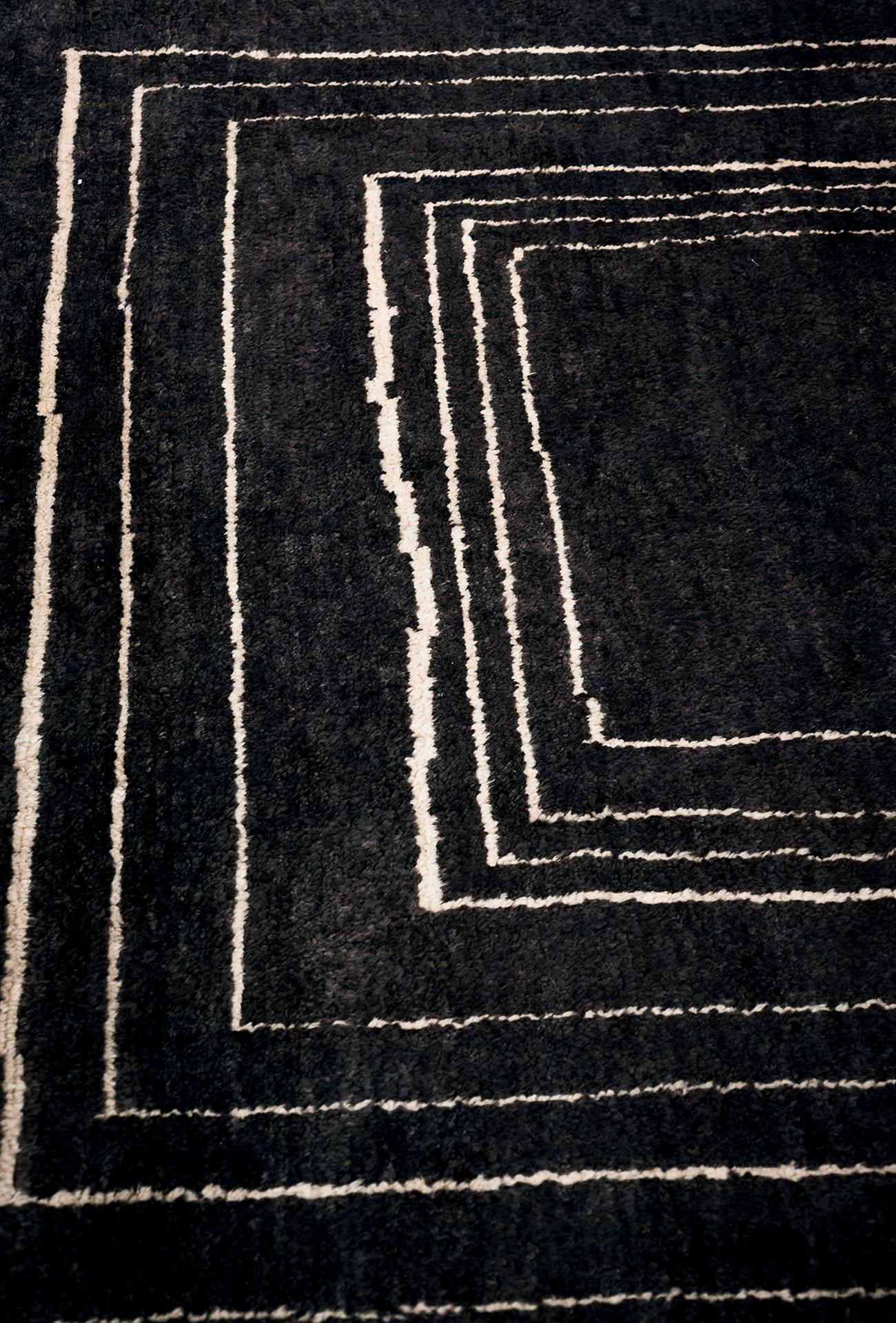 Made in Italy.

This rug is completely hand-knotted on traditional vertical looms in hand-spun wool, following the features of the Berber-Moroccan rugs of the beginning of ‘900. The finishing process is very elaborate: after the first shave and the