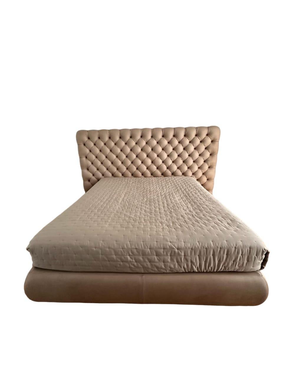 BAXTER HEAVEN LEATHER BED BY  PAOLA NAVONE. 
YEAR: 2010
CATEGORY: BED/BED FRAME. 
Bedspring: Width: 190 x 210 cm; 
Length:180 x 200 cm; Height: 32 cm. 
Headboard: Width 268; Height: 13 cm; 
Length: 152 cm. 