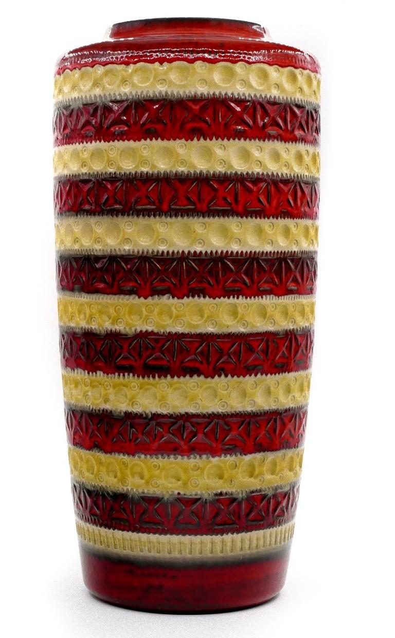 Bay ceramic vase is a ceramic decorative object manufactured in Germany by Eduard Bay Keramikfabriken, circa 1970s.

Original vase in red and yellow marked with 609/50.

Dimensions: cm 51 x 24 (diameter). In good conditions, except for very