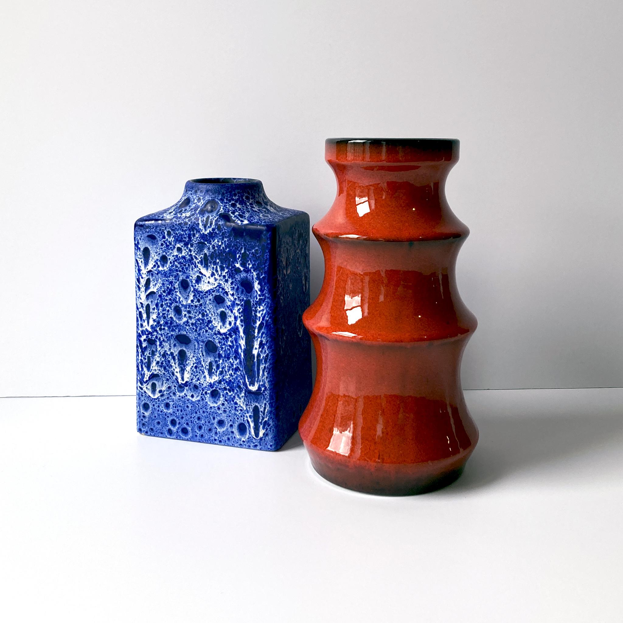 Bay Keramik tiered vase in a stunning bright red orange glaze with black interior, circa 1960s. Stamp on base 922-25.

Measurements:
H 10