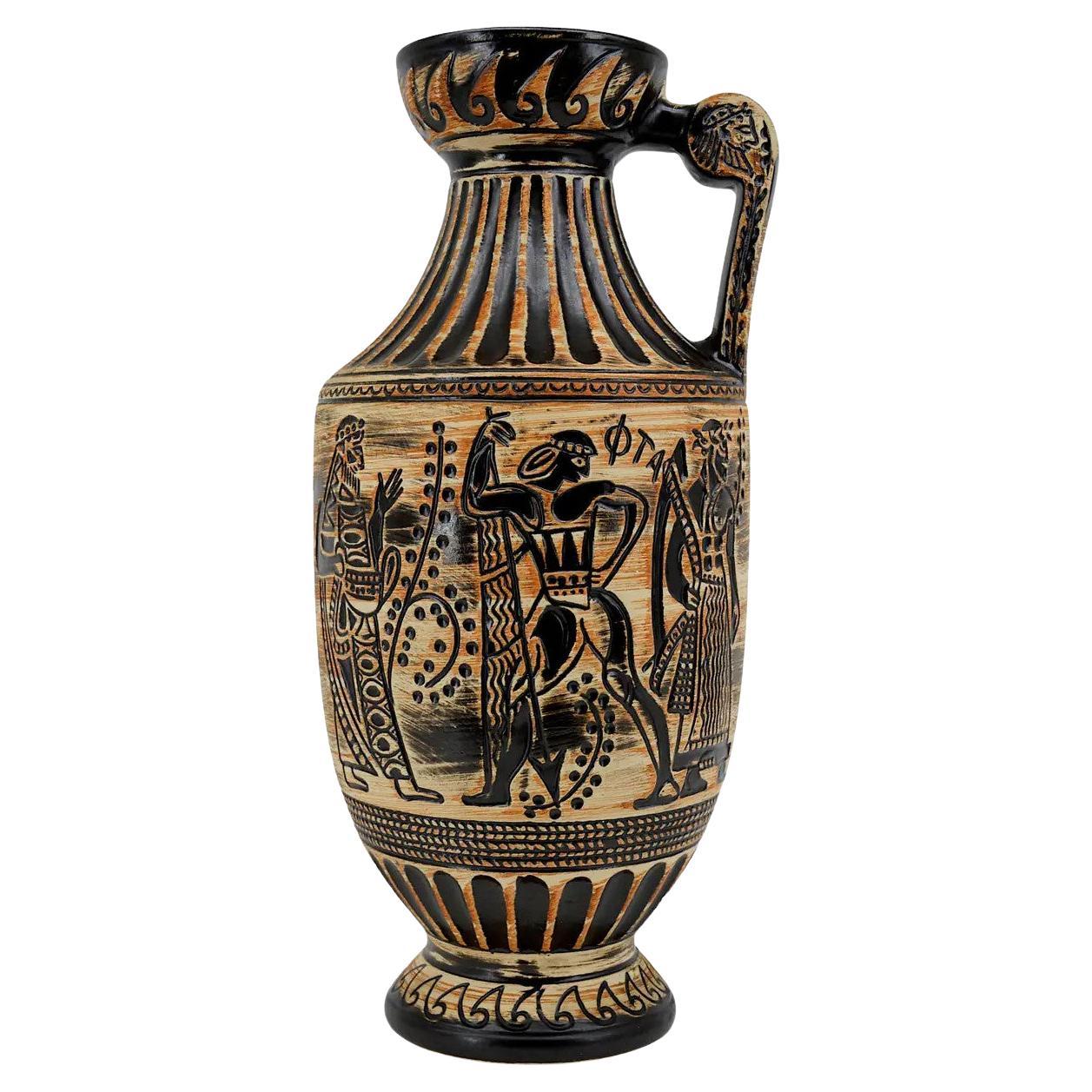 Large mid-century stoneware vase with a handle by Bay Keramik, Germany. Magnificent revolving decor showing Sumerian characters and scenes of life. Measures: Height: 17.9