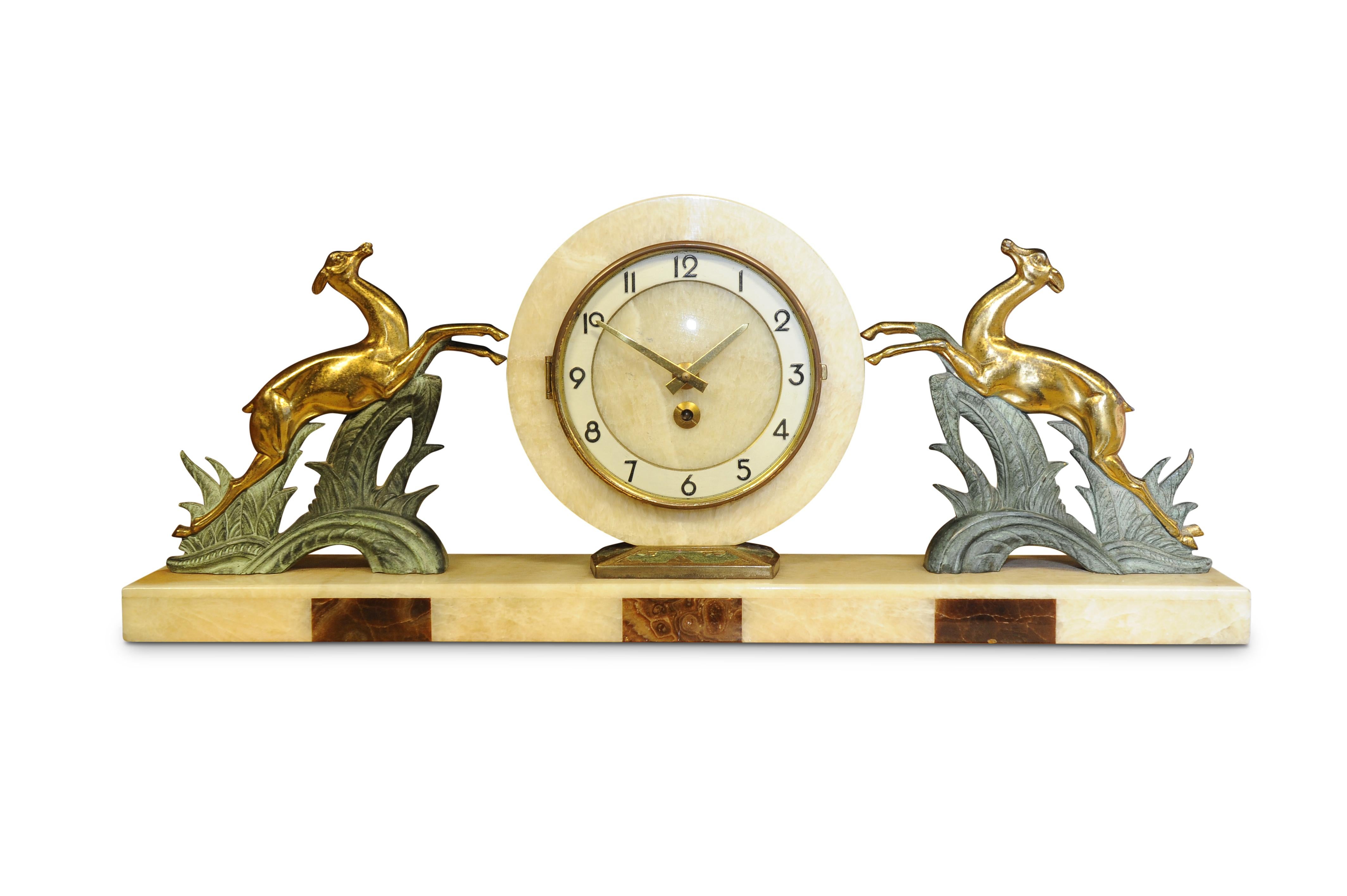 Bayard Art Deco onyx, marble and spelter mantel (fireplace) clock with gilt leaping deer

Albert Villon established his clock making shop in 1867 in St Nicholas D'Aliermont in Northern France, he specialized in marine clocks and travel/carriage