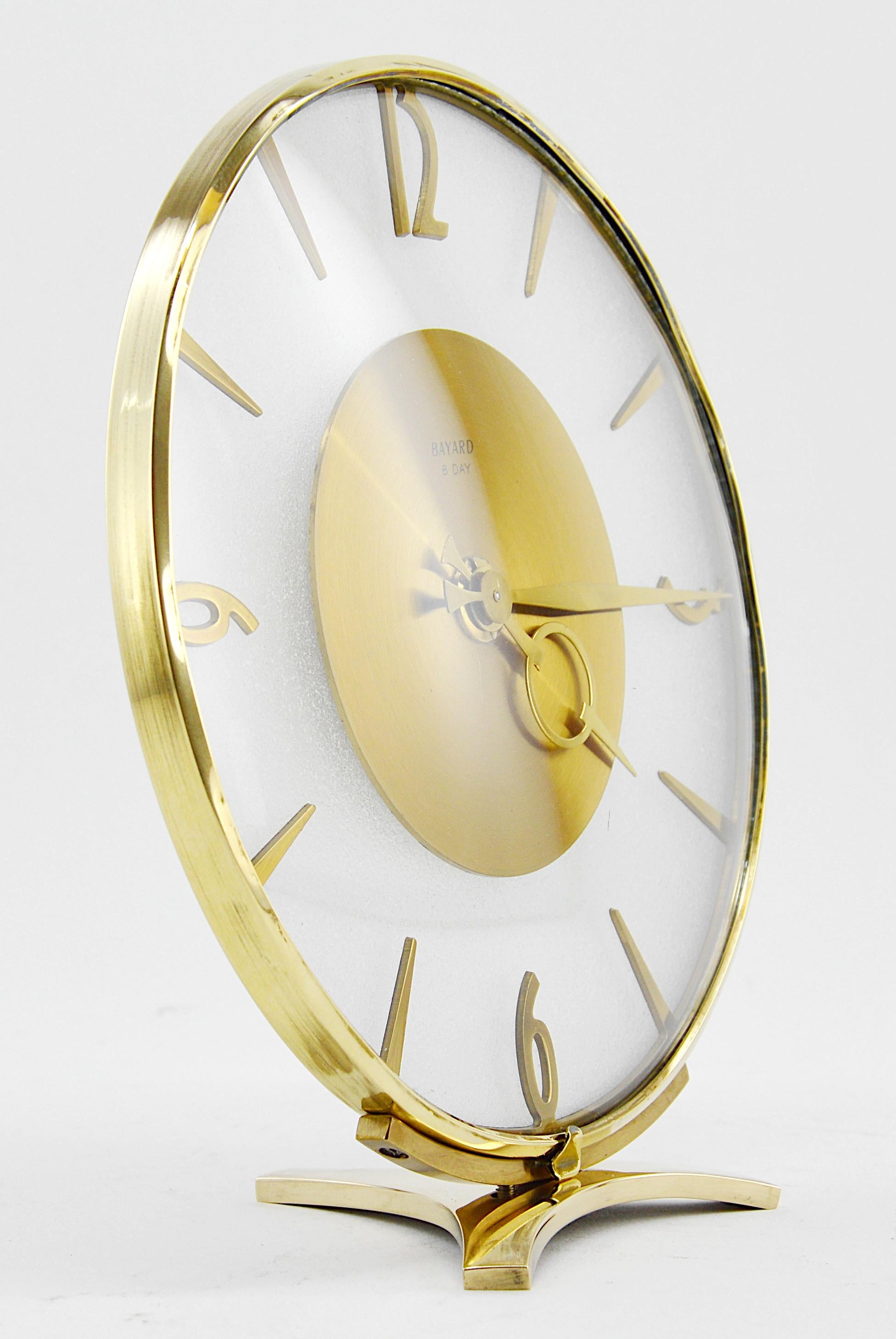 Summer sales. We are renewing our stock waiting for the start of September. Do not wait to order this beautiful period piece, we only have one. French Art Deco clock by Bayard, France, 1930s. Brass and glass. Rounded front glass - Granitelike back