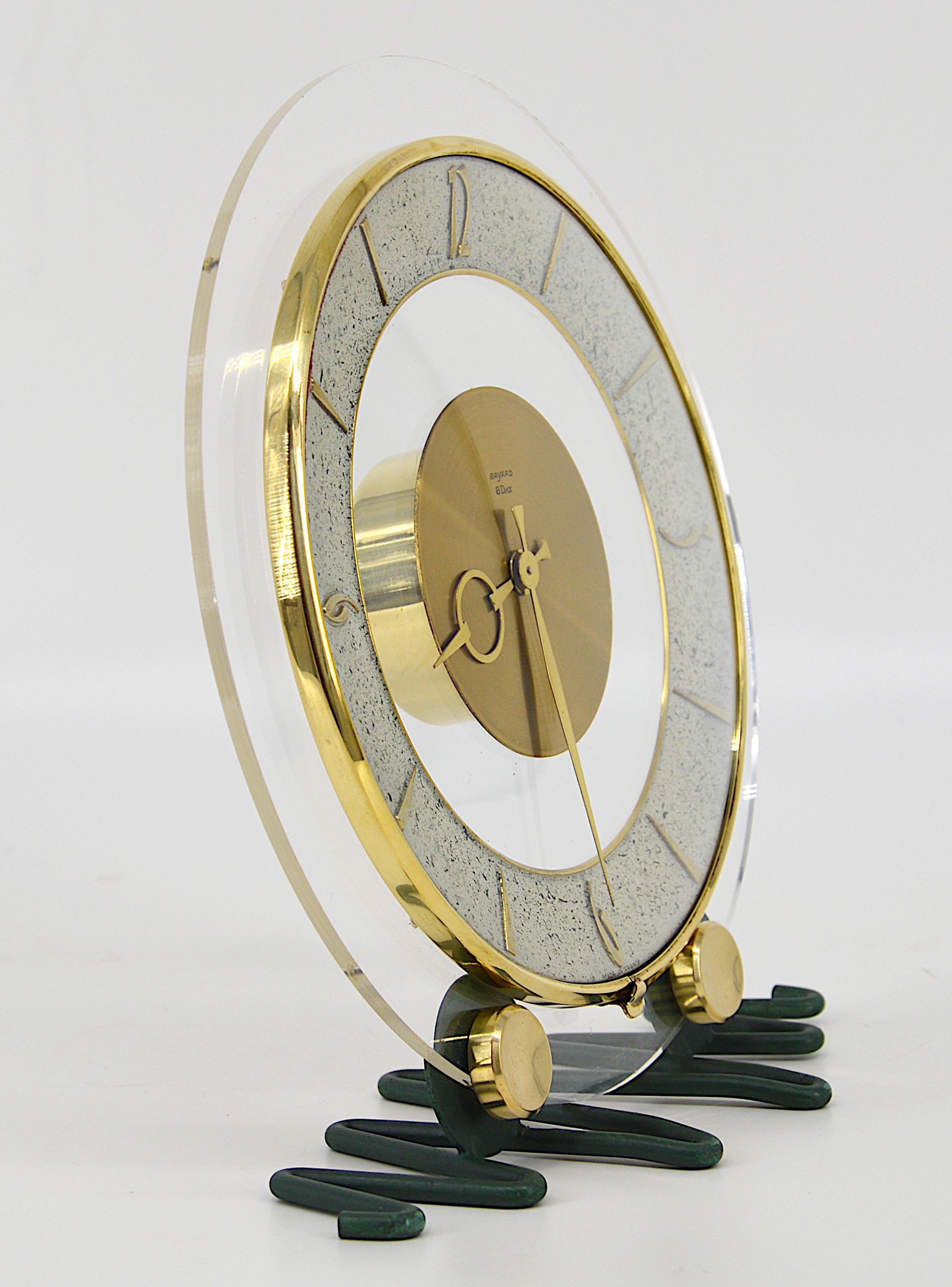 French Art Deco clock by Bayard, France, 1930s. Brass and metal frame. Plastic back and rounded glass. 8 days movement. Measures: Height 8.6