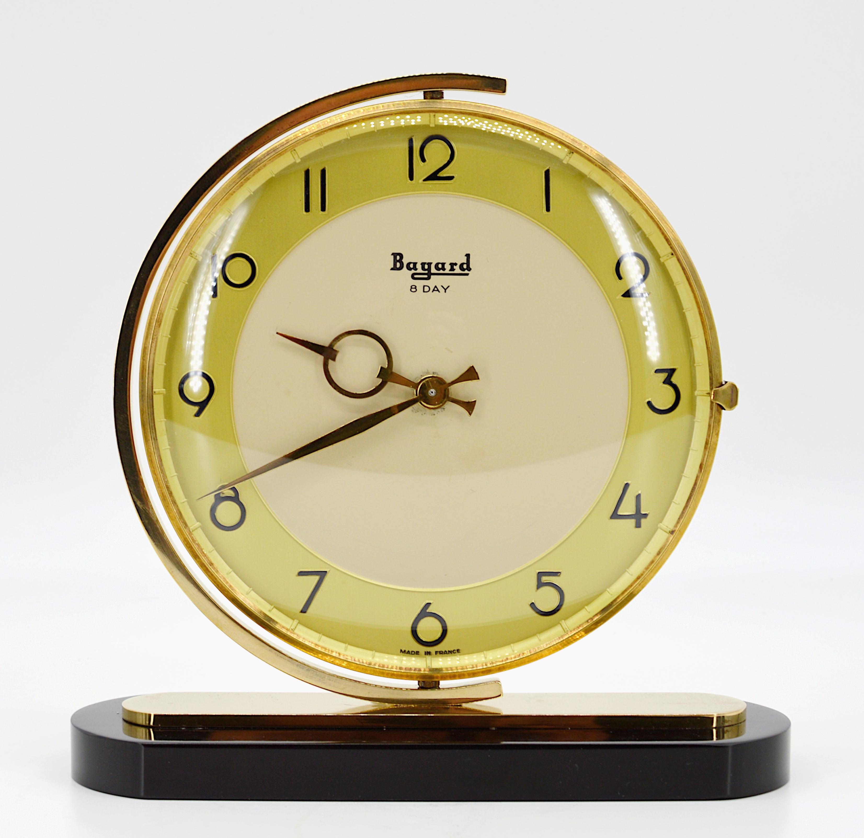 French Art Deco table clock by Bayard, France, 1930s. Brass, marble and glass. Swivel brass dial. Marble base. Rounded glass. 8 days movement. Measures: Height 7.5