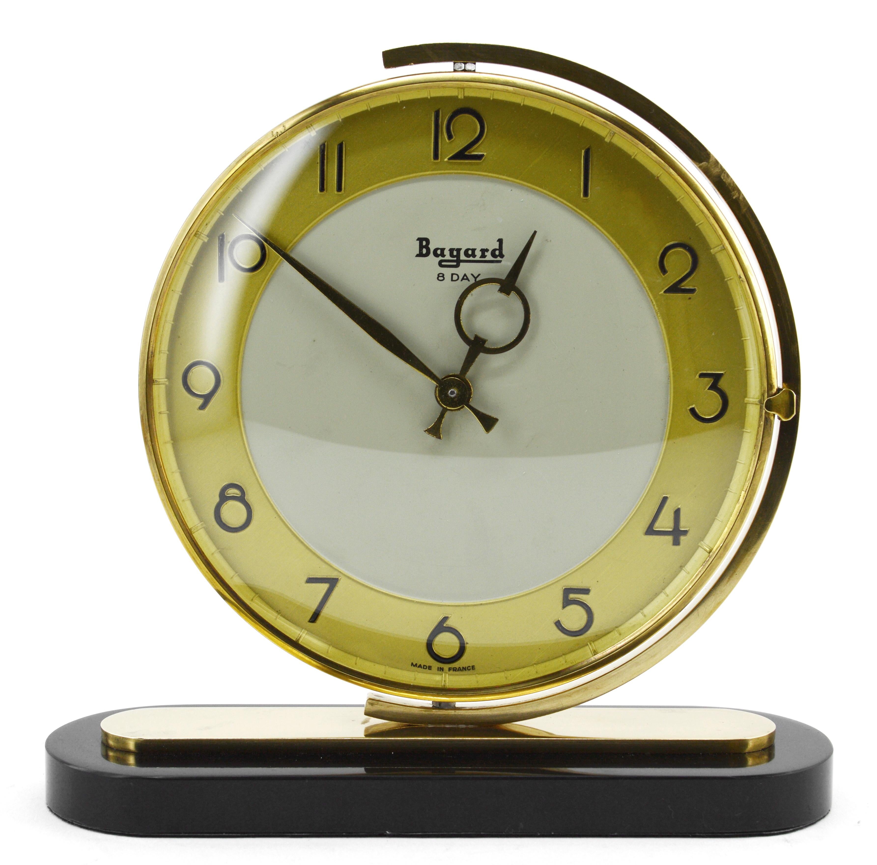 French Art Deco table clock by Bayard, France, 1930s. Brass, marble and glass. Swivelling brass dial. Marble base. Rounded glass. 8 days movement.
Original mechanism. Works perfectly.